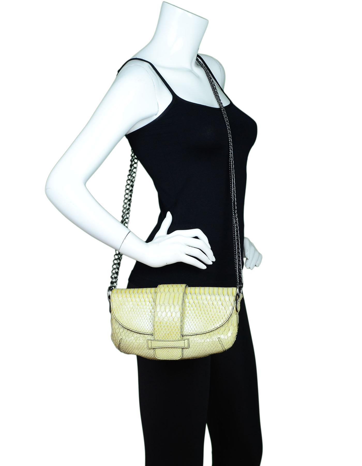Sigerson Morrison Beige Python Crossbody

Made In: Italy
Color: Beige
Hardware: Gunmetal
Materials: Python, metal
Lining: Black textile
Closure/Opening: Flap top with front tab closure
Exterior Pockets: None
Interior Pockets: Zip wall pocket
Overall