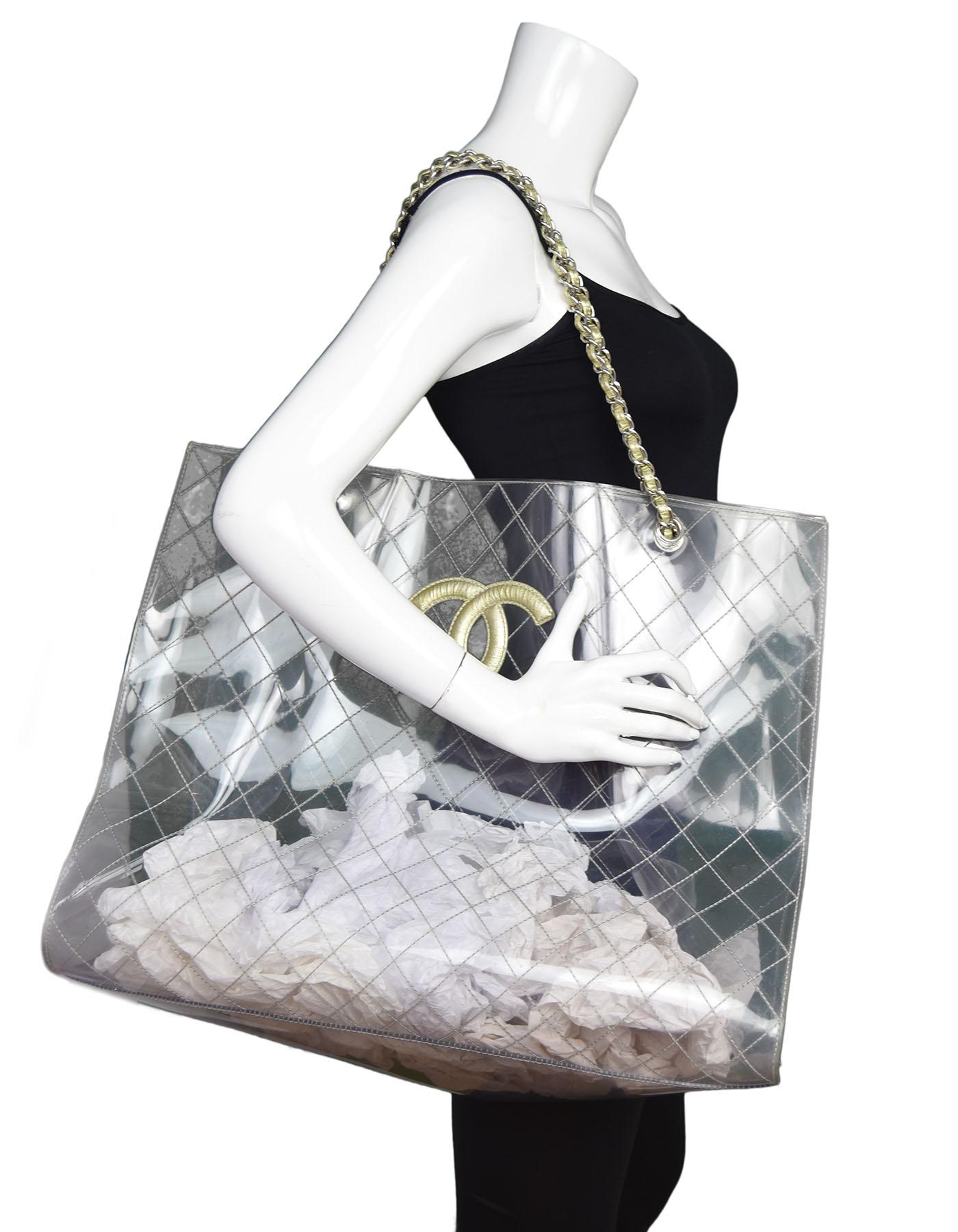 Chanel Clear Quilted PVC XXL CC Tote

Made In: France
Year of Production: 2006-2008
Color: Clear, gold, silver
Hardware: Silvertone
Materials: PVC, leather, metal
Lining: None
Closure/opening: Open top
Exterior Pockets: None
Interior Pockets: