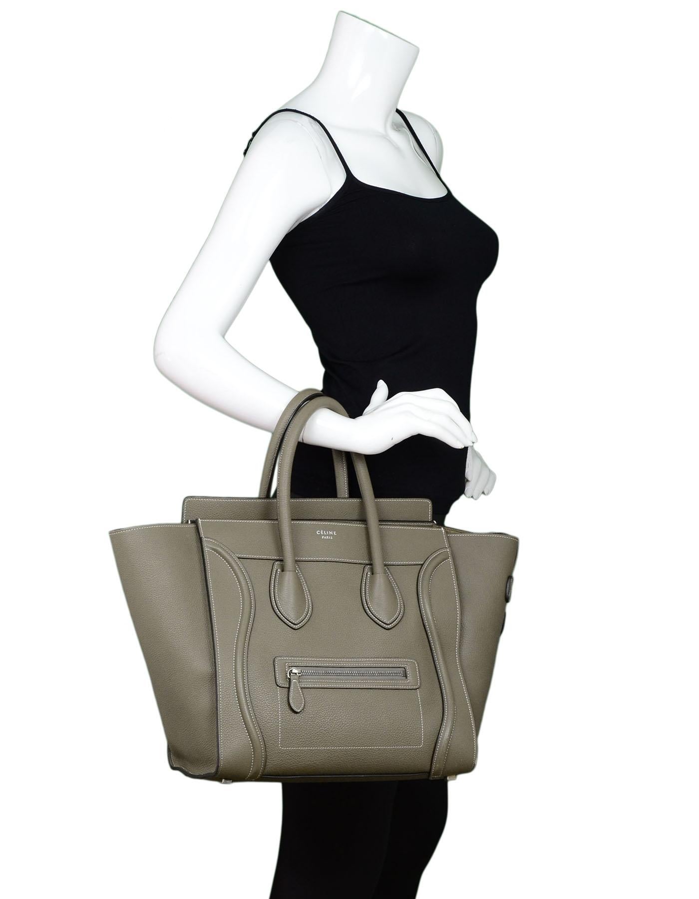 Celine Souris Grey Drummed Calfskin Mini Luggage Tote

Made In: Italy
Color: Souris grey
Hardware: Silvertone
Materials: Leather, metal
Lining: Grey suede
Closure/Opening: Zip top closure
Exterior Pockets: Front zip pocket
Interior Pockets: One zip