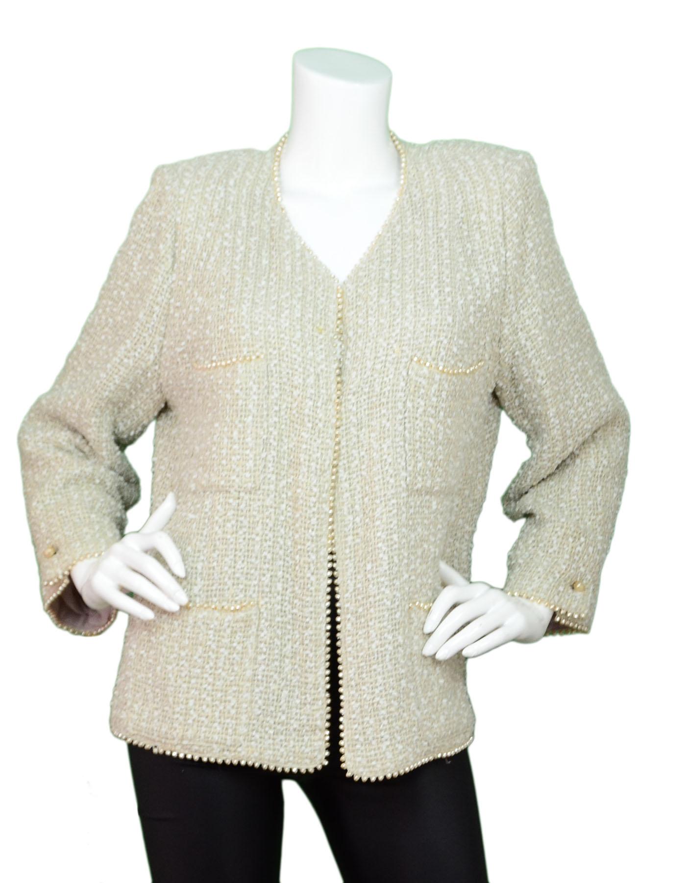 Chanel Beige Tweed Jacket with Faux Pearl Trim Sz FR48
Features faux pearl trim throughout

Made In: France
Year of Production: 1999
Color: Beige
Composition: 44% cotton, 27% wool, 14% nylon, 12% rayon, 3% linen
Lining: Beige wool
Closure/Opening: