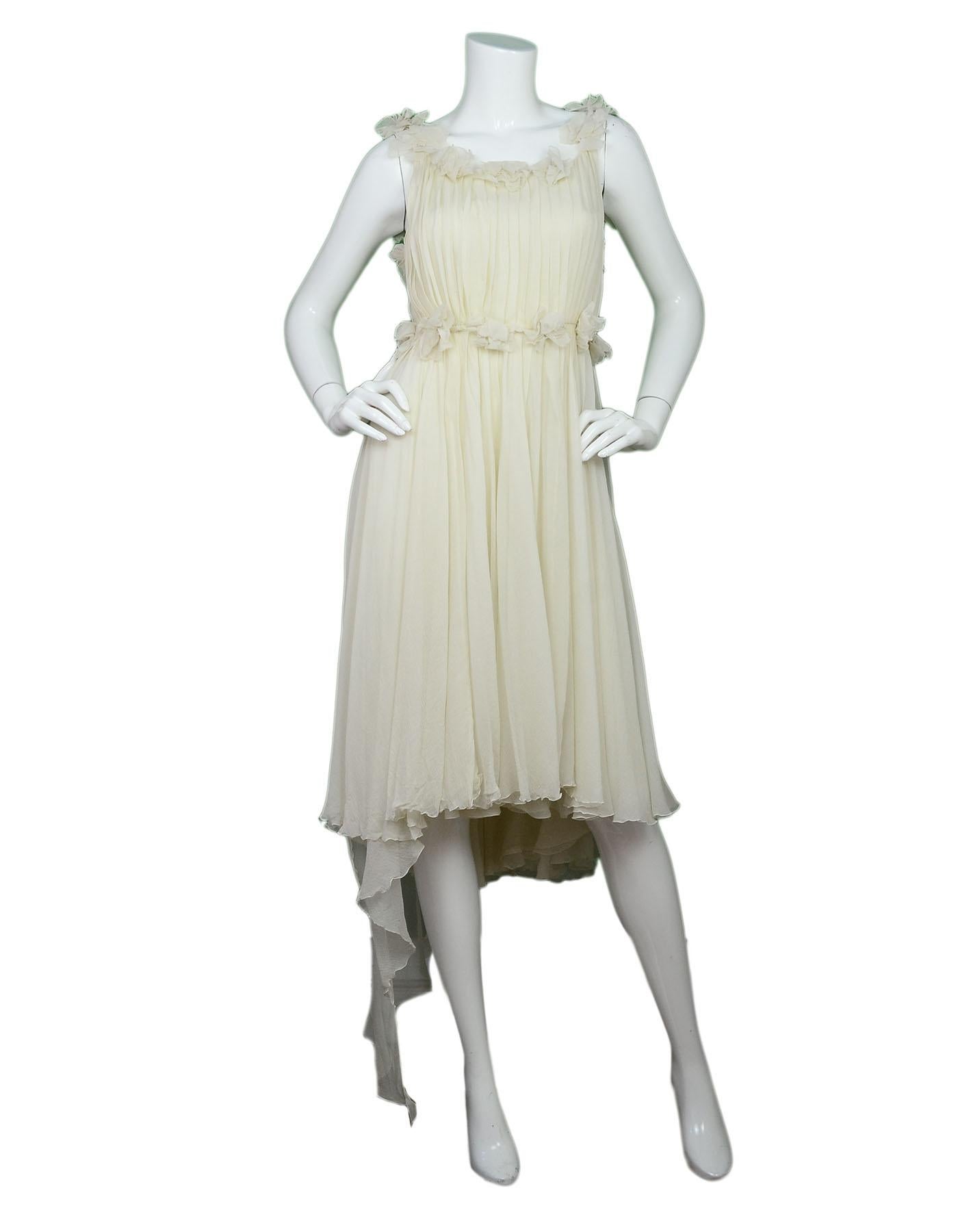 Chanel Cream Silk Chiffon Dress with Mesh Rosettes Sz FR38

Made In: France
Year Of Production: 2003
Color: Cream
Composition: 100% silk
Lining: Silk lining
Closure/Opening: Back zip closure
Exterior Pockets: None
Interior Pockets: None
Overall