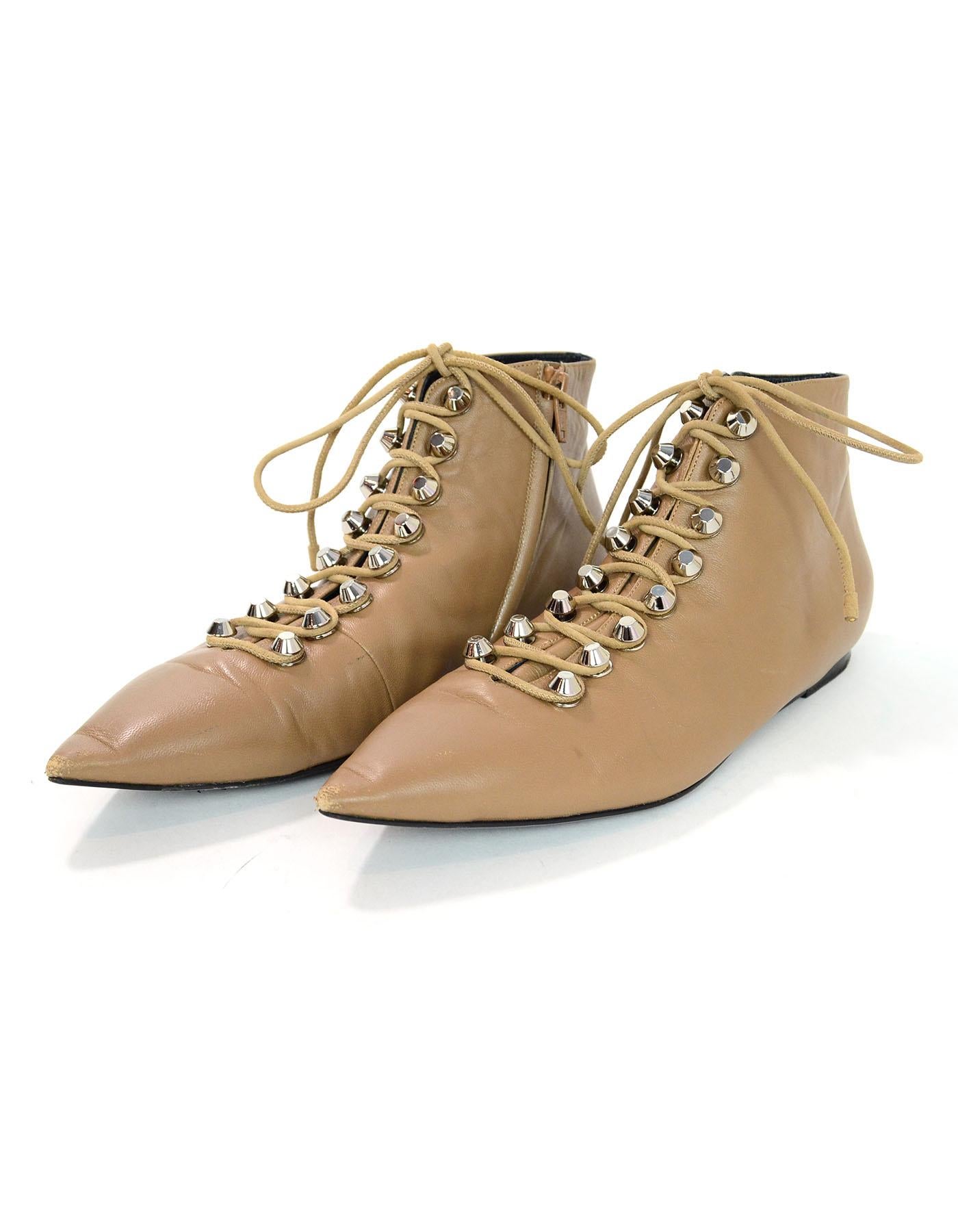 Balenciaga Tan Leather Pointed Toe Ankle Boots Sz 40

Made In: Italy
Color: Tan 
Materials: Leather
Closure/Opening: Lace tie closure
Sole Stamp: Balenciaga 40 Made in Italy
Overall Condition: Very good pre-owned condition with the exception of some