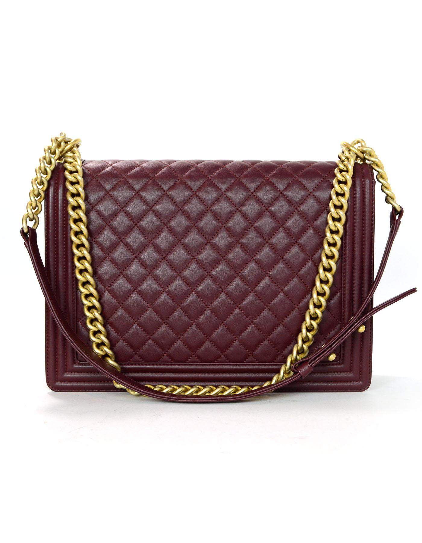Chanel Burgundy Lambskin Leather Large Boy Bag. 
Features matte goldtone and burgundy lambskin leather strap that can be worn doubled on the shoulder, or singled to be used cross-body

Made In: Italy
Year of Production: 2017-2018
Color: