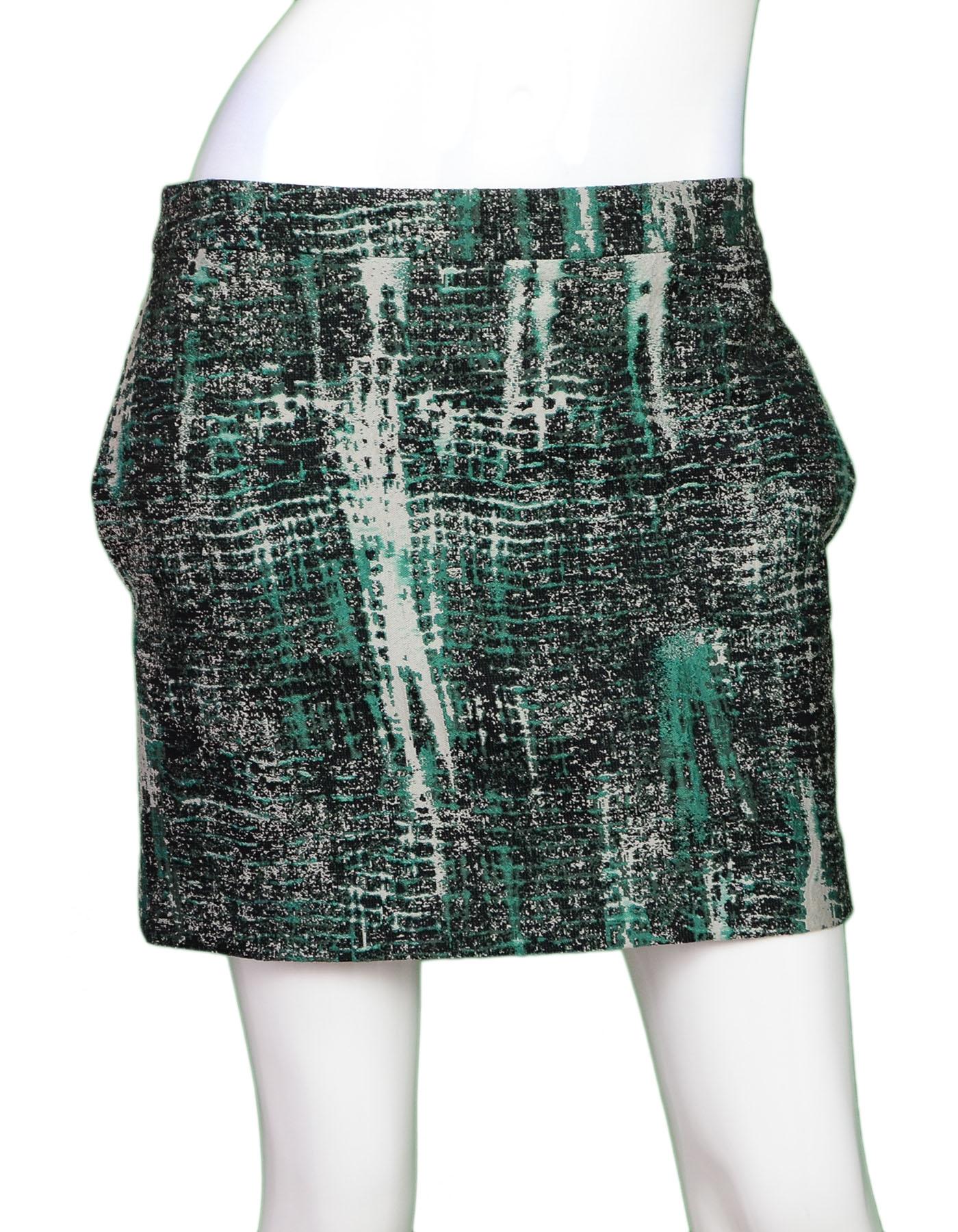 Stella McCartney Green & Black Mini Skirt Sz IT40 NWT

Made In: Hungary
Color: Green, black, cream
Composition: 54% polyester, 46% rayon
Lining: None
Closure/Opening: Back zip closure
Overall Condition: Excellent pre-owned condition, NWT

Marked