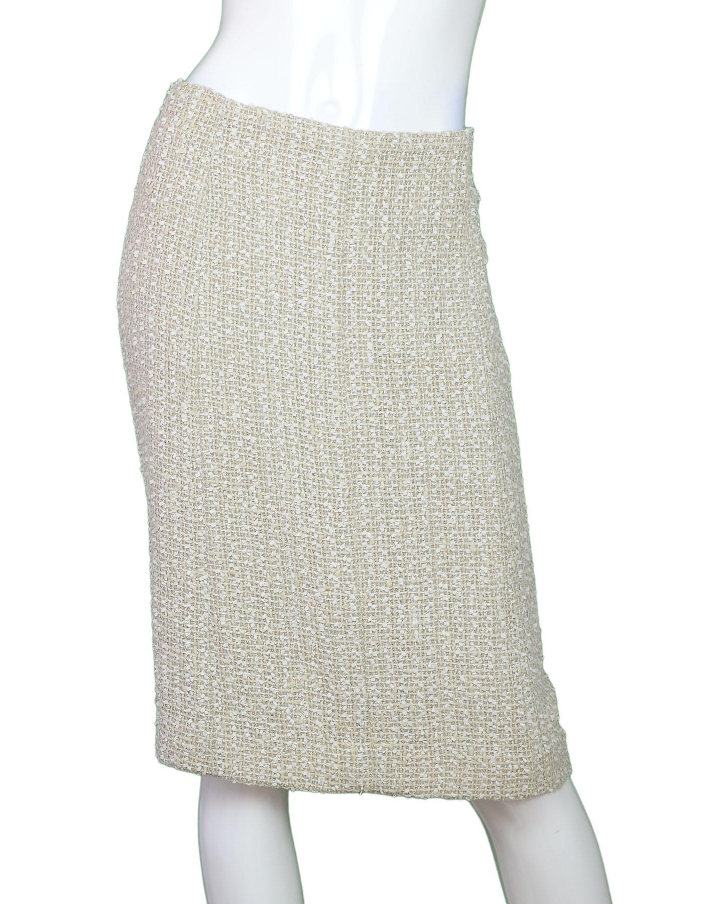Chanel Beige Tweed Skirt Sz FR48

Made In: France
Year of Production: 1999
Color: Beige
Composition: 44% cotton, 27% wool, 14% nylon, 12% rayon, 3% linen
Lining: Beige wool
Closure/opening: Back zipper
Exterior Pockets: None
Overall Condition: