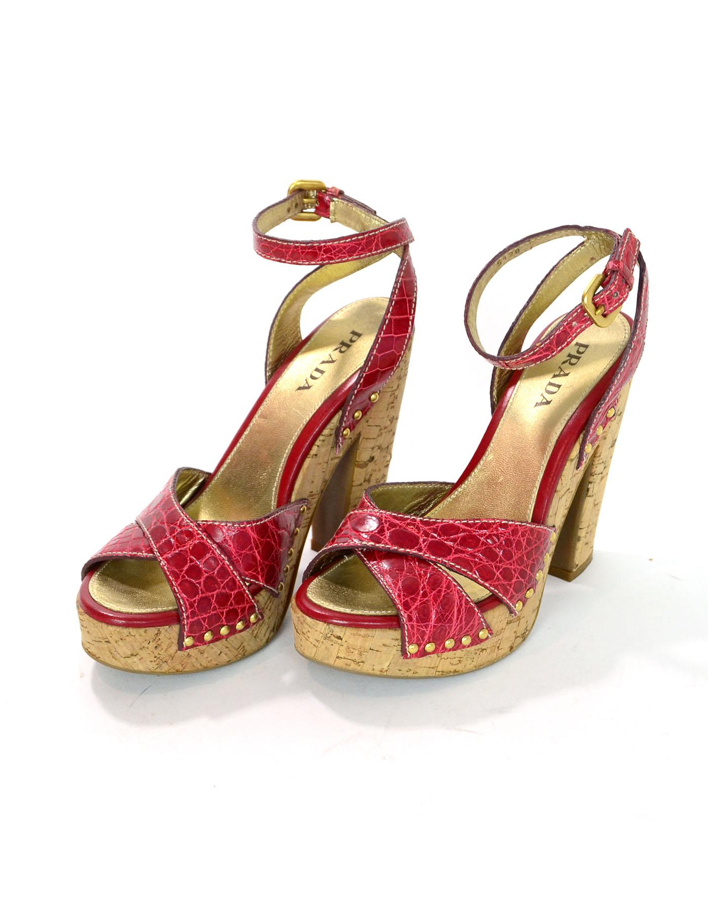 Prada Red Crocodile & Cork Sandals Sz 37

Made In: Italy
Color: Red
Materials: Leather, cork
Closure/Opening: Buckle closure at ankle
Sole Stamp: Prada 37 Made in Italy
Overall Condition: Excellent pre-owned condition with the exception of some wear