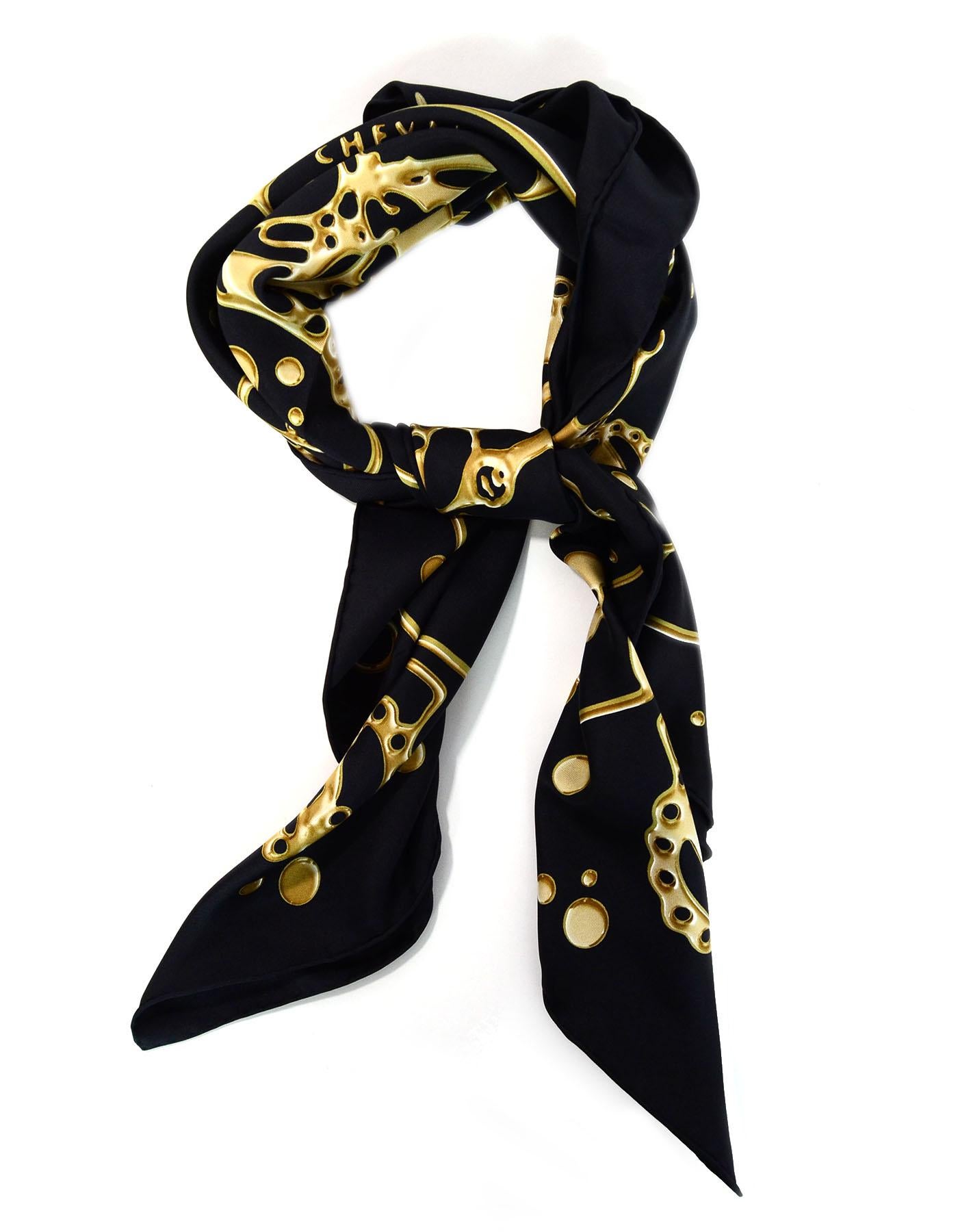 Hermes Black & Gold Cheval Fusion Silk 90cm Scarf
Features abstract horse motif

Made In: France
Color: Black, gold
Composition: 100% Silk
Overall Condition: Excellent pre-owned condition
Included: Hermes box, shopping bag,