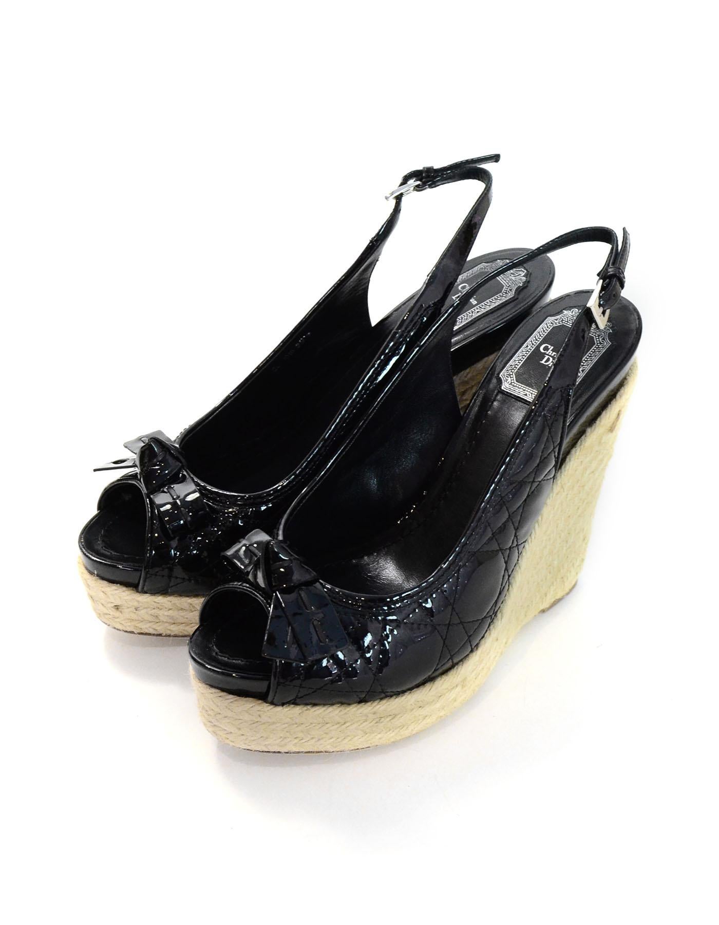 Christian Dior Black Patent Cannage Wedges Sz 39.5 NIB

Made In: Italy
Color: Black, beige
Materials: Patent leather, jute rope
Closure/Opening: Slingback strap with buckle
Sole Stamp: Dior made in Italy 39.5
Overall Condition: Excellent pre-owned