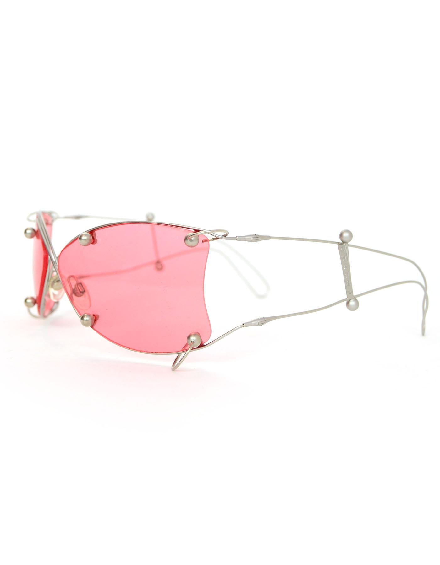 Chanel Wire-Frame and Pierced Pink Lens Sunglasses

Made In: Italy
Color: Silver, pink
Materials: Metal, glass
Overall Condition: Very good pre-owned condition with the exception of some scratches at lenses and soiling at nose pads
Included: Chanel