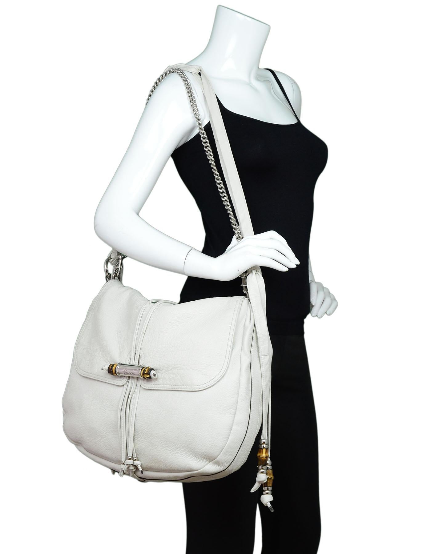 Gucci White Calfskin Large Jungle Shoulder Bag

Made In: Italy
Color: White
Hardware: Silvertone
Materials: Calfskin leather, bamboo, metal
Lining: Black textile
Closure/Opening: Flap top
Exterior Pockets: None
Interior Pockets: Zip wall pocket, two