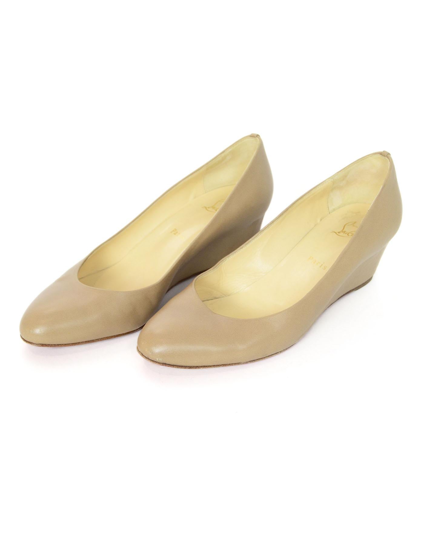 Christian Louboutin Nude Leather Wedges Sz 41

Made In: Italy
Color: Nude
Materials: Leather
Closure/Opening: Slide on
Sole Stamp: Christian Louboutin Paris 41
Overall Condition: Excellent pre-owned condition with the exception of some wear at