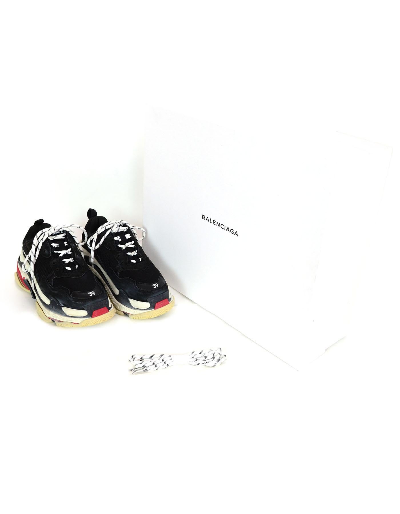 Balenciaga Black/Red Triple S Trainers sz 39
American style oversized sneakers with washed vintage effect

Made In: Italy
Color: Red/black/white 
Materials: Nubuck and meshes- 60% Polyester, 25% Calfskin, 15% Lambskin
Closure/Opening: Lace up
Sole