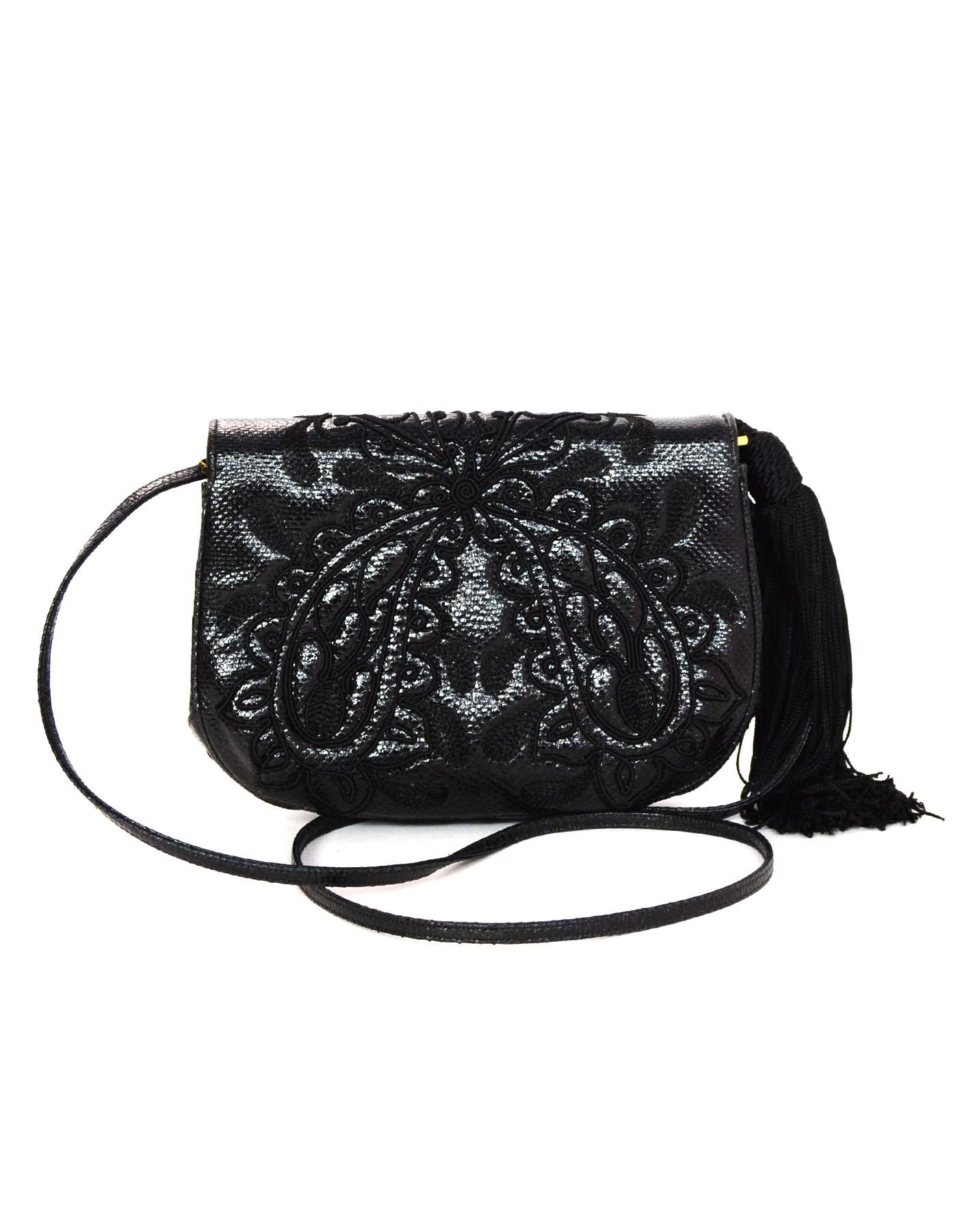 Judith Leiber Vintage Embroidered Black Lizard Bag
Featurs tassel ornament at side and optional/extra goldtone chain strap

    Color: Black
    Hardware: Goldtone
    Materials: Lizard, metal
    Lining: Black textile
    Closure/opening: Flap top