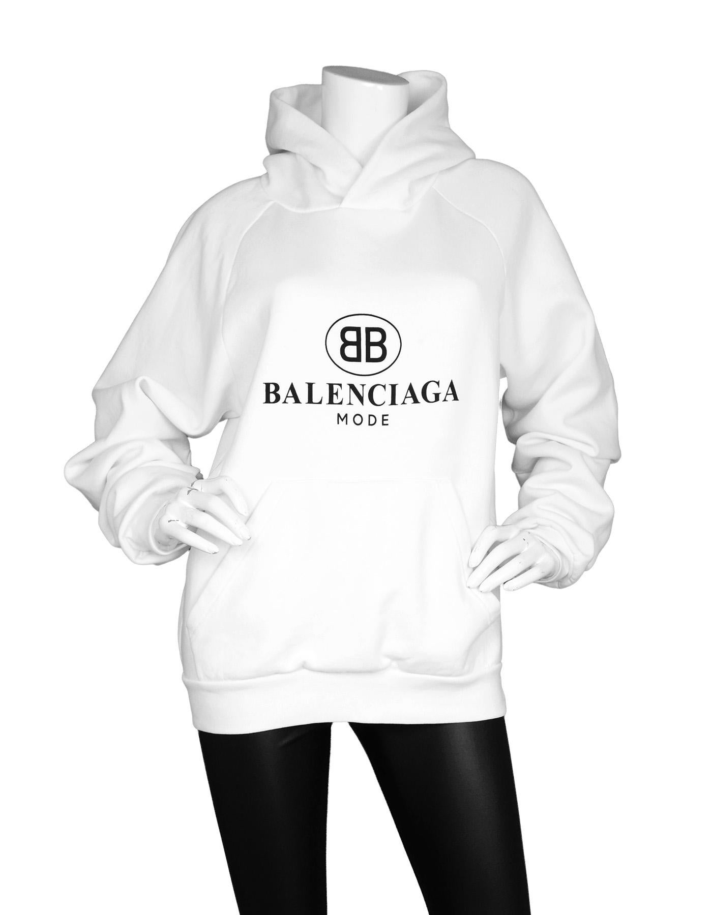Balenciaga Unisex White BB Mode Hoodie

Made in: Portugal
Color: White with black lettering
Composition: 80% cotton, 20% polyester
Closure/Opening: Pull over
Exterior Pockets: One sweatshirt patch
Overall Condition: Excellent pre-owned condition