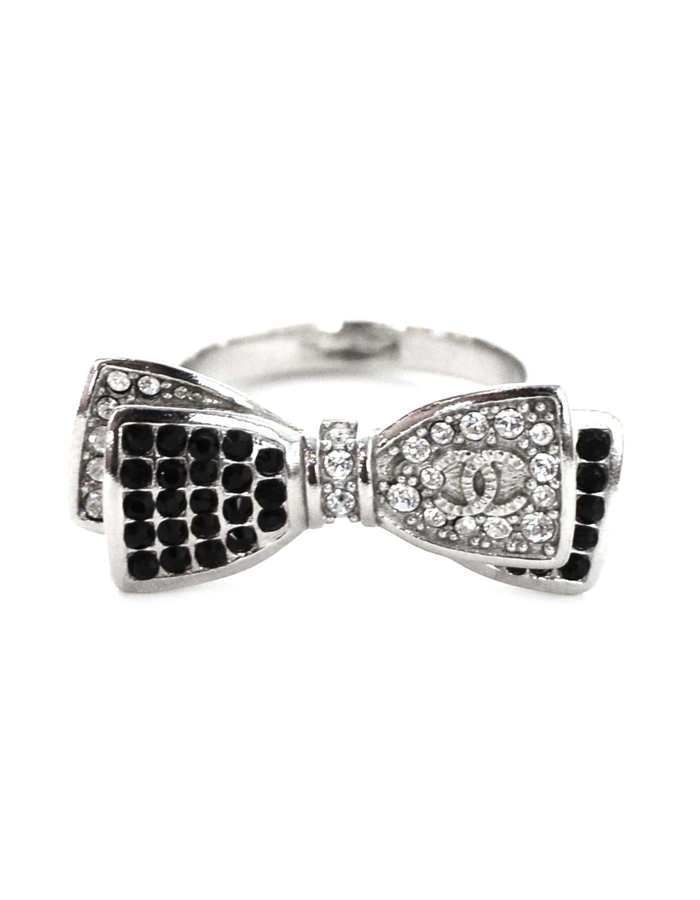Chanel 2017 Crystal CC Bow Ring.  Features black and clear strass crystals, textured band and silvertone CC.

Made In: Italy
Year of Production: 2017
Colors: Black, clear and silvertone
Materials: Crystals, metal
Overall Condition: Excellent