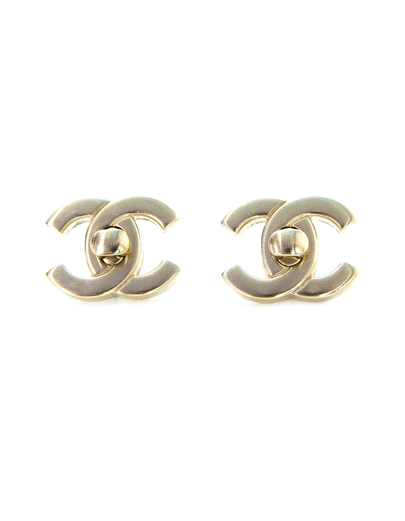 Chanel Convertable CC Twistlock Pierced Earrings. Features optional matte goldtone and iridescent CC that is changed using the center twistlock.

Made In: Italy
Year of Production: 2018
Colors: Light goldtone, iridescent multicolor
Materials:
