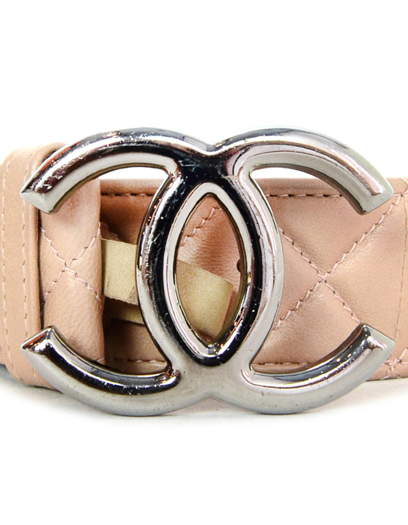 Chanel 2014 Nude Lambskin Leather Quilted Belt w/ Gunmetal CC Buckle

Made In: Italy
Year of Production: 2014
Color: Nude, gunmetal
Materials: Leather, suede, metal
Closure/Opening: Peg closure
Stamp: CHANEL B14 CC P MADE IN ITALY
Overall Condition: