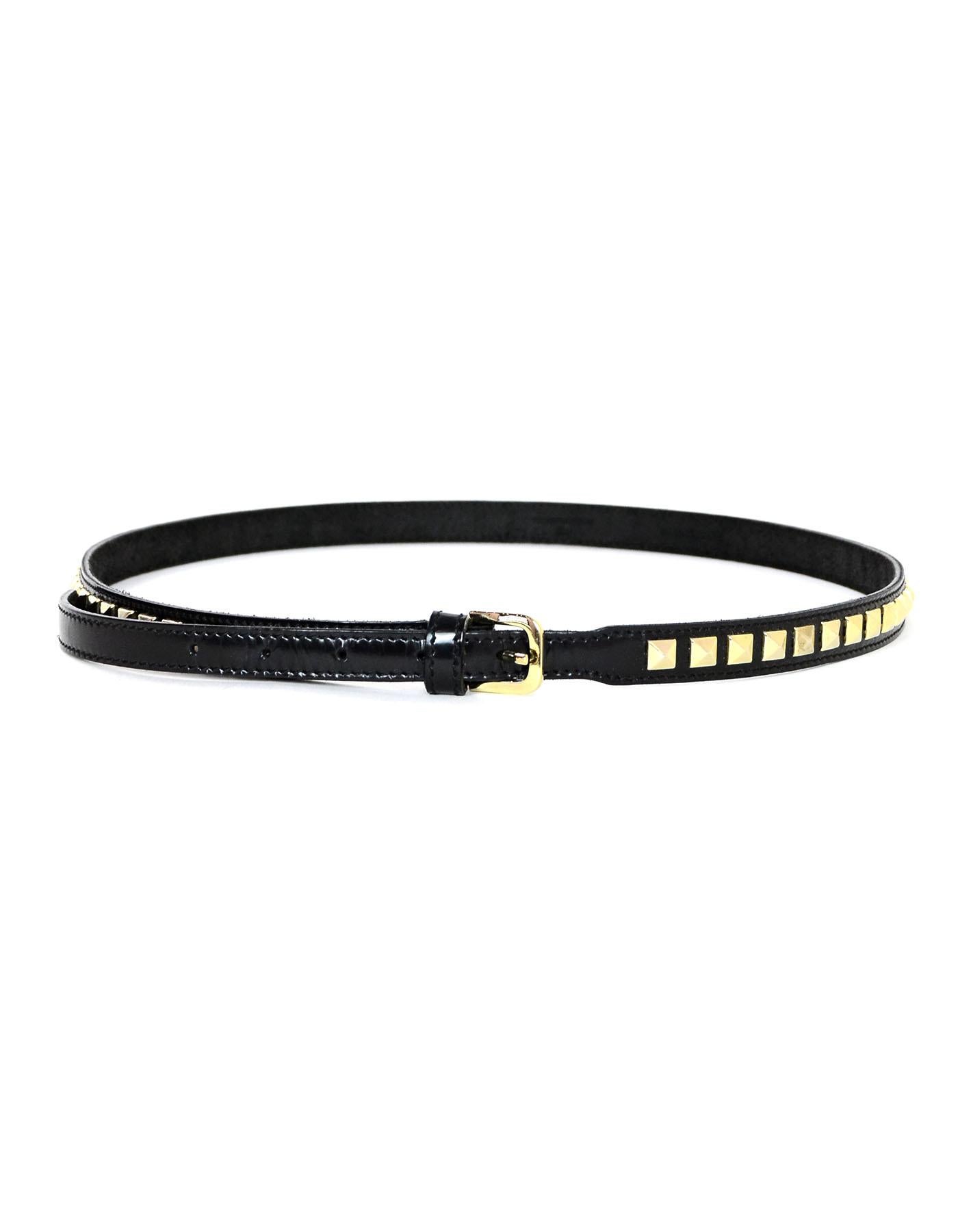 Burberry Black/Gold Glazed Leather Studded Belt

Made In: Italy
Materials: Glazed leather, metal
Colors: Black, gold
Overall Condition: Excellent pre-owned condition, light creasing to leather without studs
Includes: Burberry dustbag

Measurements: