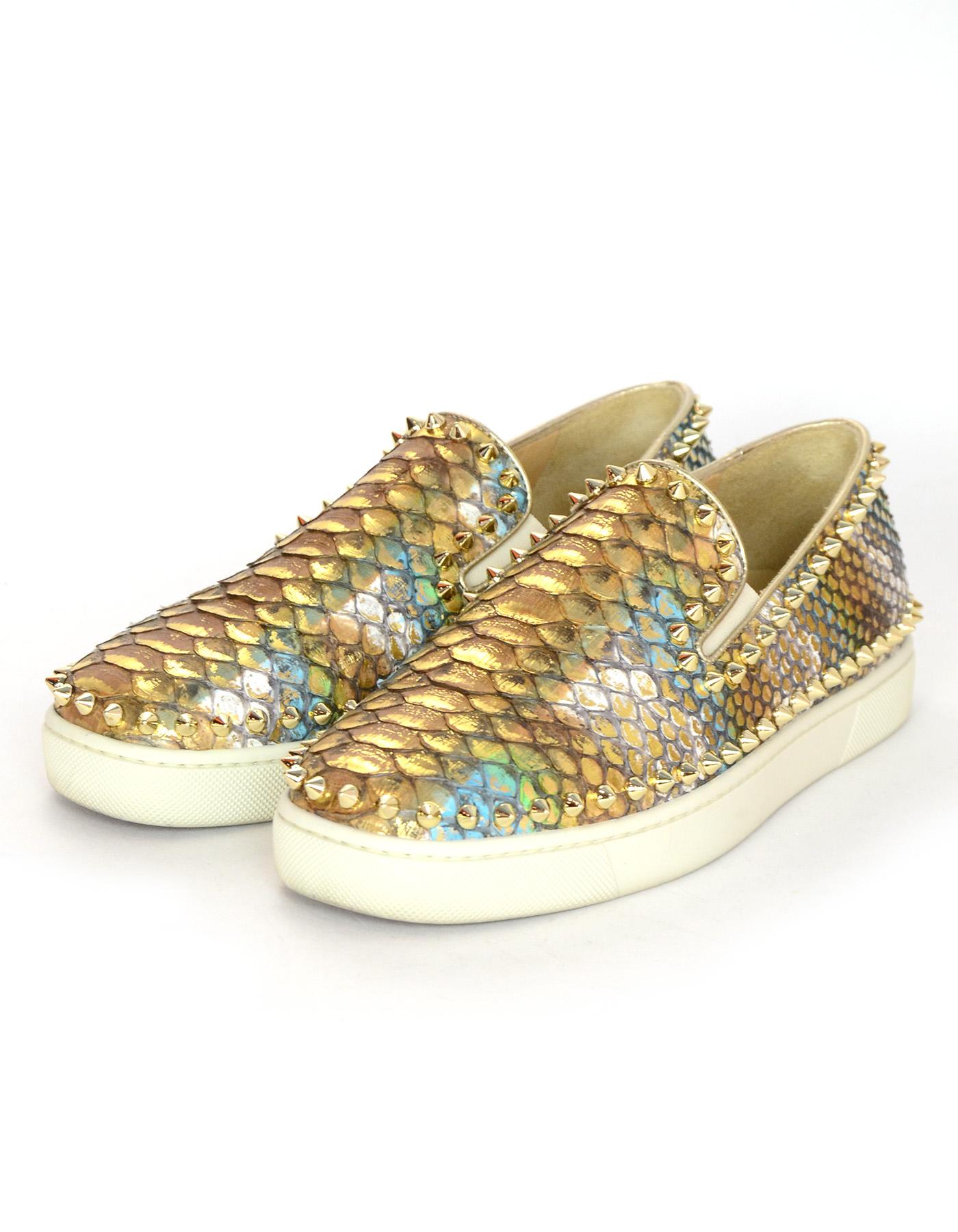 Christian Louboutin Metallic Python Studded Pik Boat Sneakers sz 38.5
Features gold/blue/green/white metallic python with gold spike studded trim

Made In: Italy
Color: Gold, white, green, blue
Materials: Python, metal, rubber,