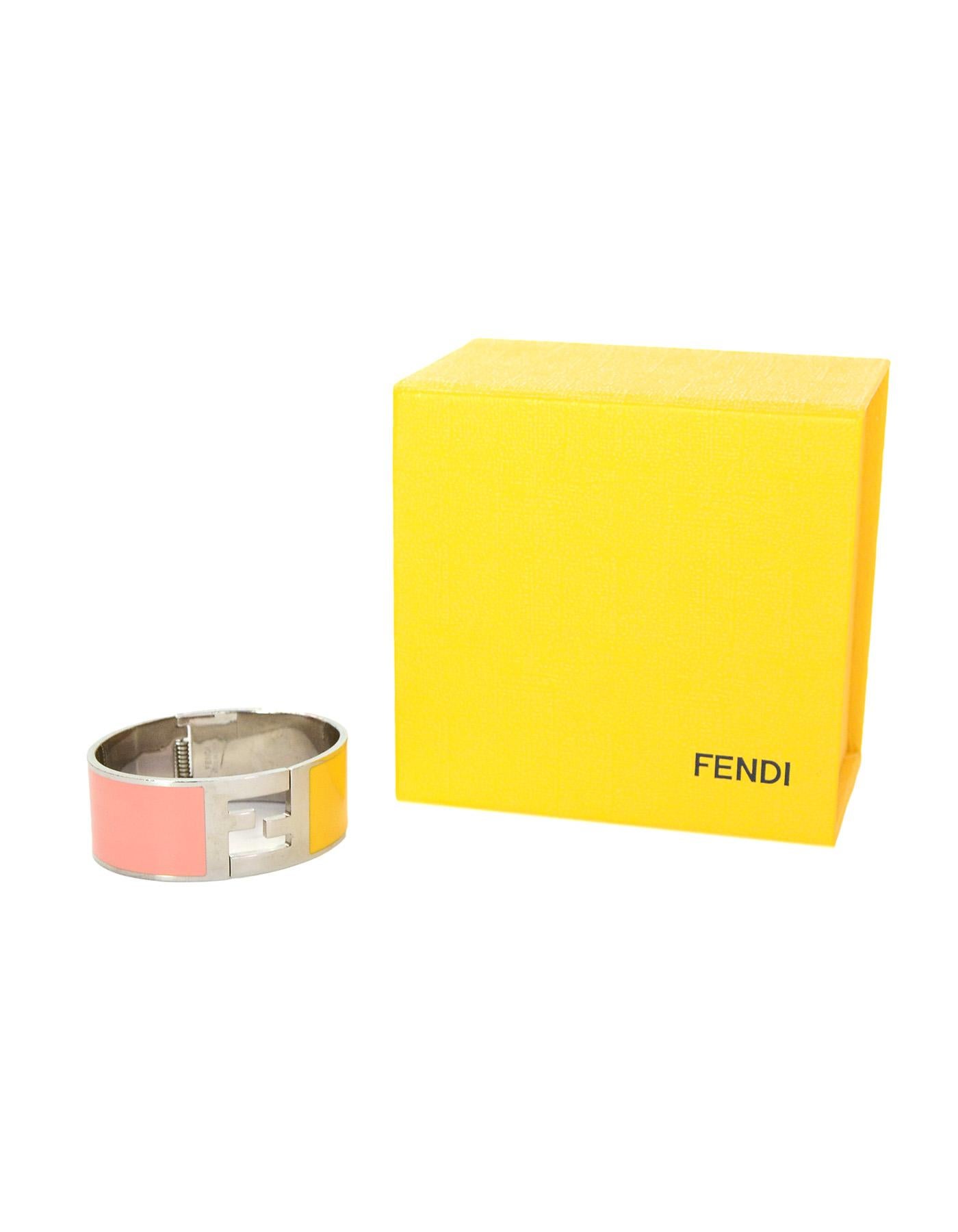 Fendi Pink & Yellow Clic Clac Silvertone Bangle Bracelet With Box

Made In:  Italy
Color: Pink, yellow, silvertone
Materials:  Enamel and metal
Hallmarks: On interior back: 