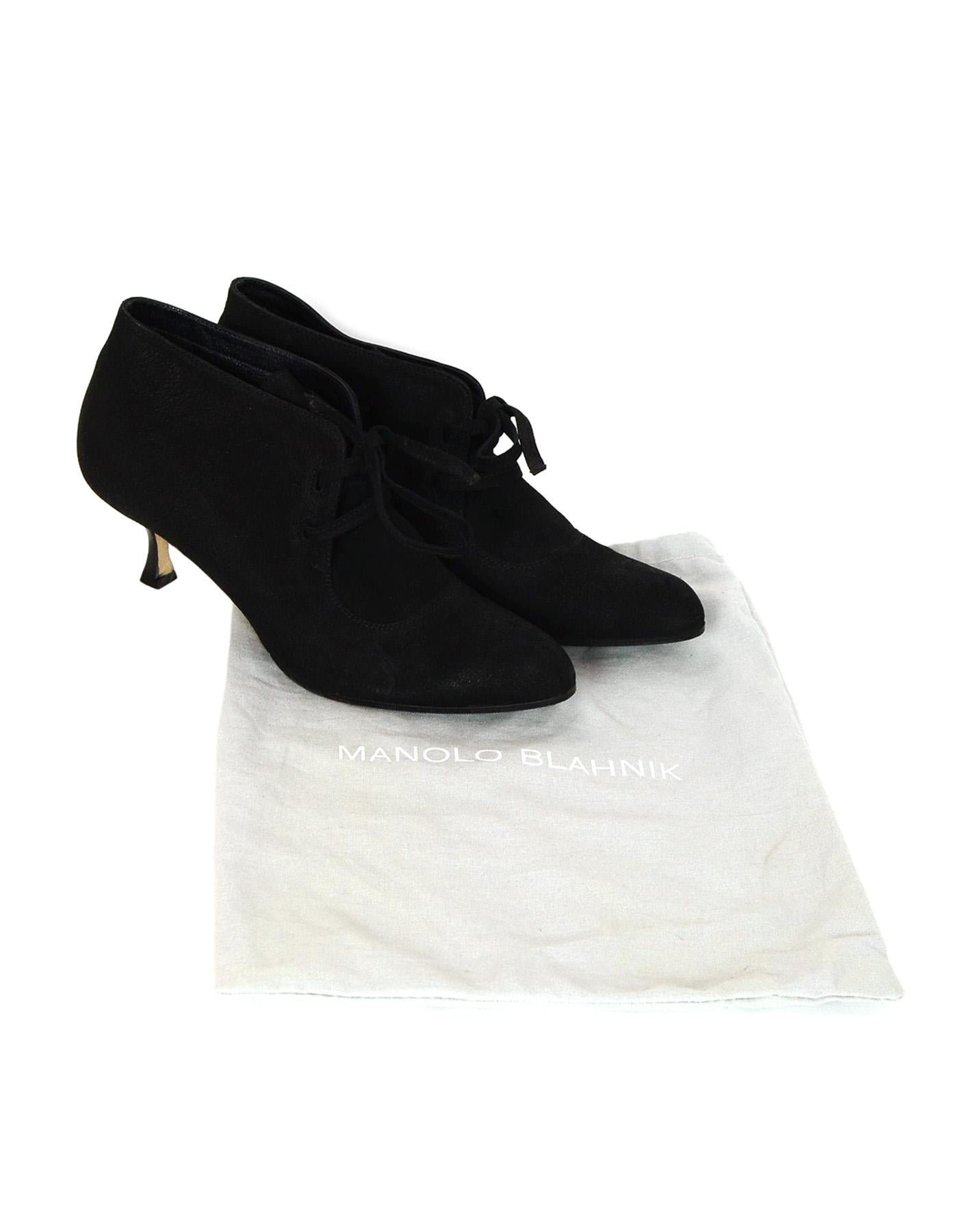 Manolo Blahnik Black Suede Lace Up Ankle Heeled Booties Sz 39.5

Made In: Italy
Color: Black 
Materials: Suede
Closure/Opening: Lace up front 
Overall Condition: Excellent pre-owned condition, minor wear on soles
Includes:  Dust bag

Measurements: