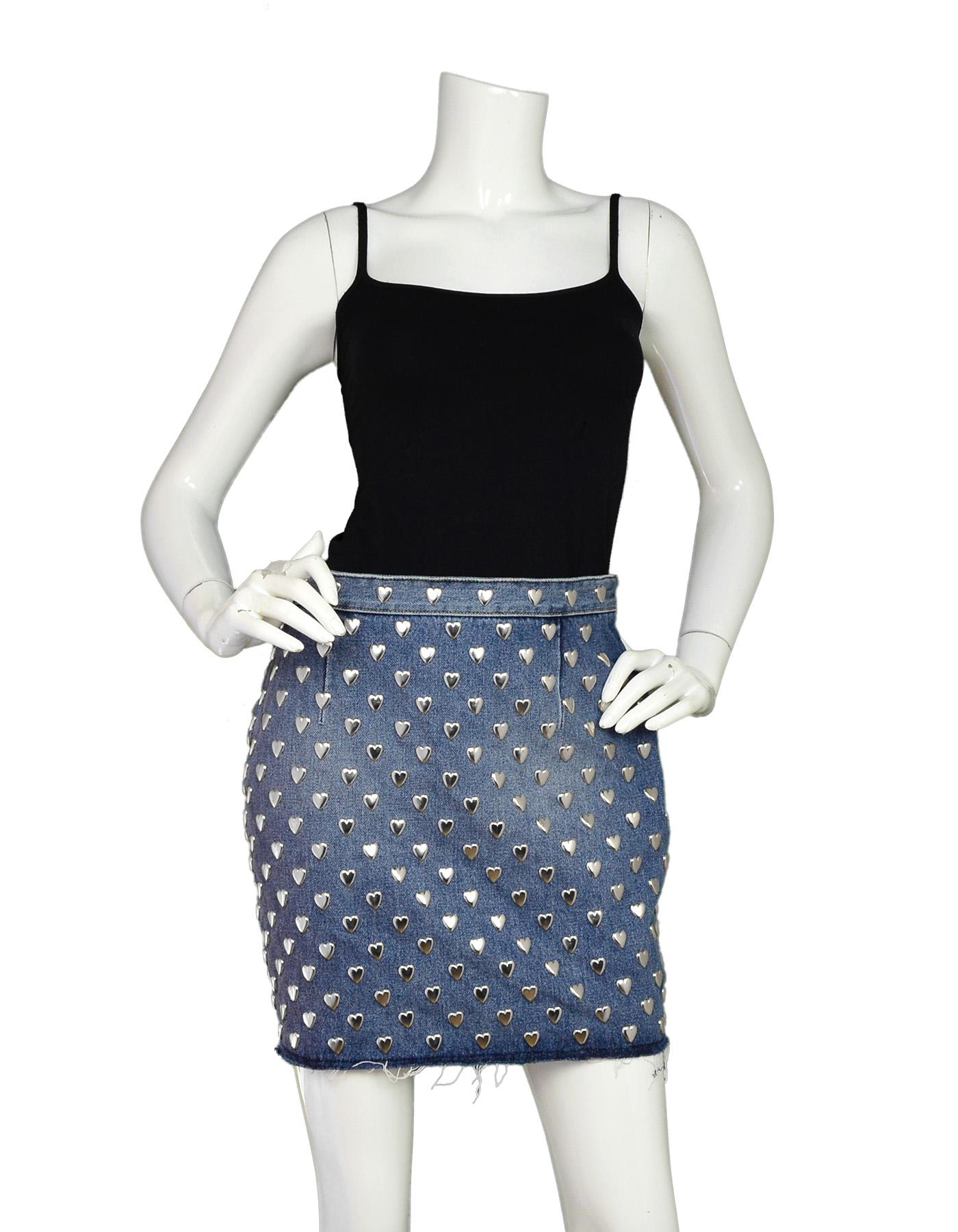 Saint Laurent Blue Denim Silver Heart Stud Mini Skirt Sz 29 With Raw Hem

Made In:  Italy
Color: Blue and silver
Materials: 100% cotton denim and silvertone metal heart studs
Lining: Fully lined with 100% silk in black
Overall Condition: Excellent