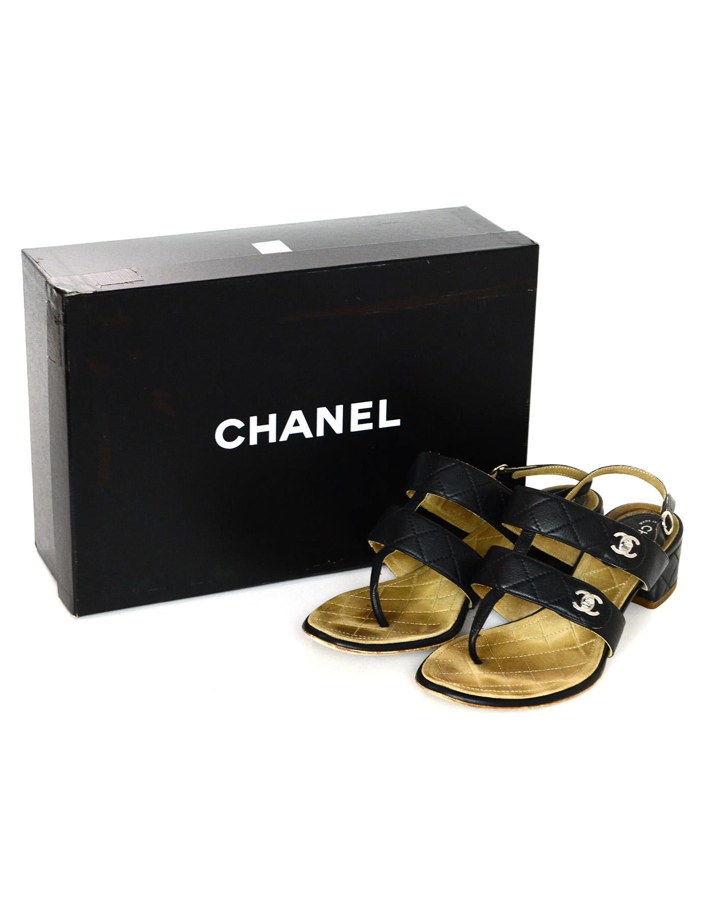 Chanel Black Calfskin Quilted CC Turnlock Thong Heeled Sandals Sz 38

Made In: Italy
Year of Production: 2011
Color: Black
Hardware: Silvertone
Materials: Calfskin leather
Closure/Opening: Sling back with adjustable buckle closure
Overall Condition: