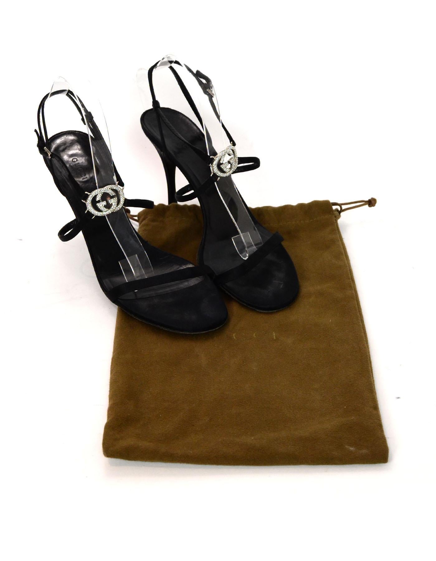 Gucci Black Satin Heeled Sandals W/ Crystal GG Logo Sz 41C Wide. Includes Dust Bag.

Made In: Italy
Color: Black
Hardware: Silvertone
Materials: Satin, metal, crystal
Closure/Opening: Buckle closure around ankle 
Overall Condition: Good pre-owned