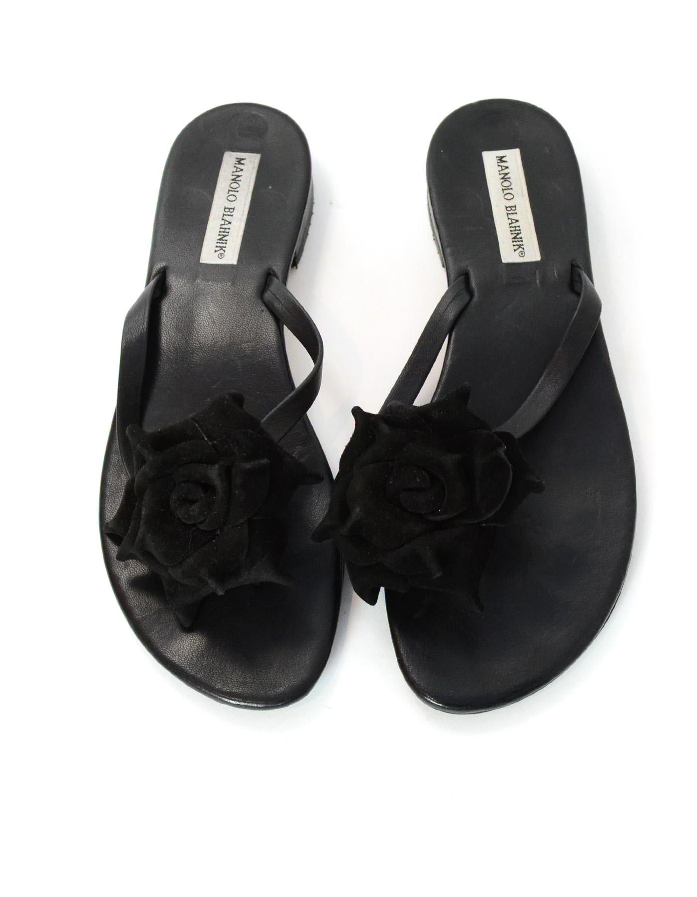 Manolo Blahnik Black Leather Thong Sandals W/ Suede Flower Sz 40

Made In: Italy
Color: Black
Materials: Leather and suede
Closure/Opening: Slide on 
Overall Condition: Excellent pre-owned condition with minimal scratching in leather 

Measurements: