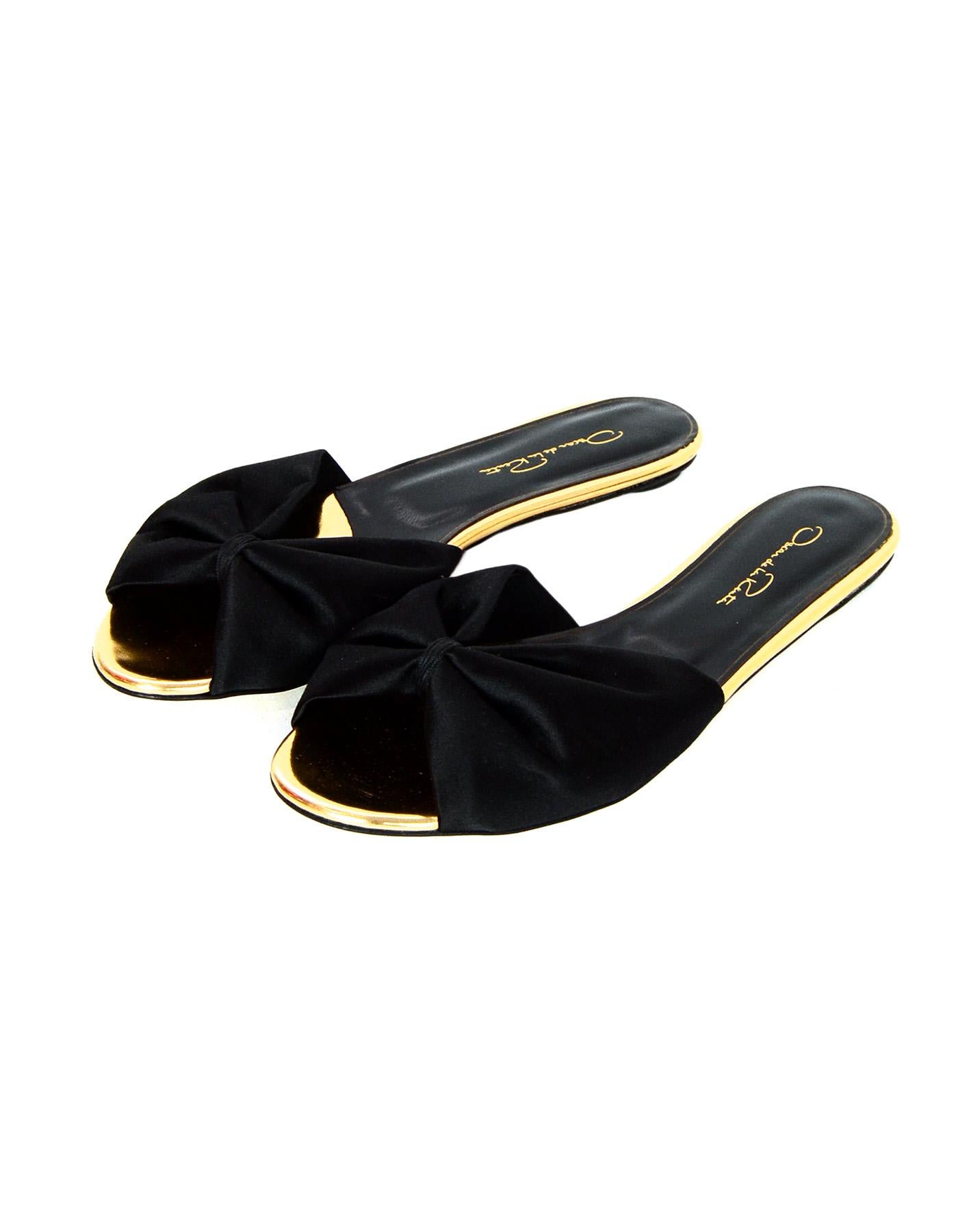 Oscar De La Renta Black Satin Bow & Specchio Mia Slides Sz 39

Made In: Italy
Color: Black and gold
Materials: Satin and specchio
Closure/Opening: Slide on
Overall Condition: Excellent pre-owned condition 
Estimated Retail: $590 + tax

Measurements: