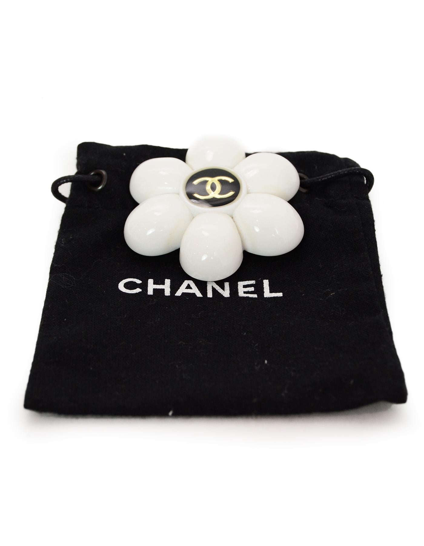 Chanel Vintage '96 CC White Daisy Flower Brooch/Pin

Made In: France
Year of Production: 1996
Color: White, black and gold
Materials: Plastic and metal
Hallmarks: 