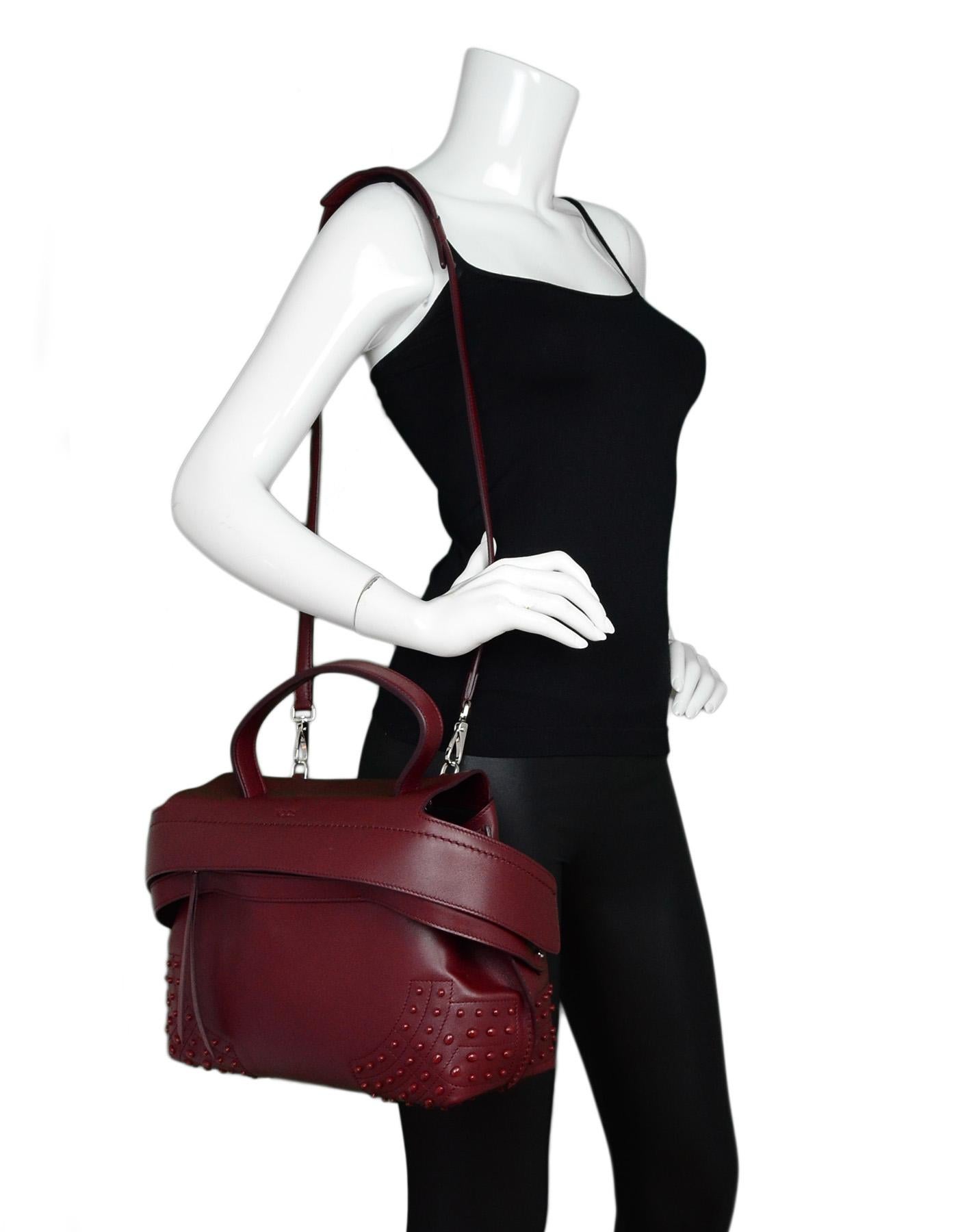 Tod's Burgundy Leather Small Wave Top Handle Shoulder Bag NEW

Made In: Italy
Color: Burgundy 
Hardware: Silvertone
Materials: Leather
Lining: Black textile
Closure/Opening: Flap top with concealed front zipper
Exterior Pockets: Rear pocket with