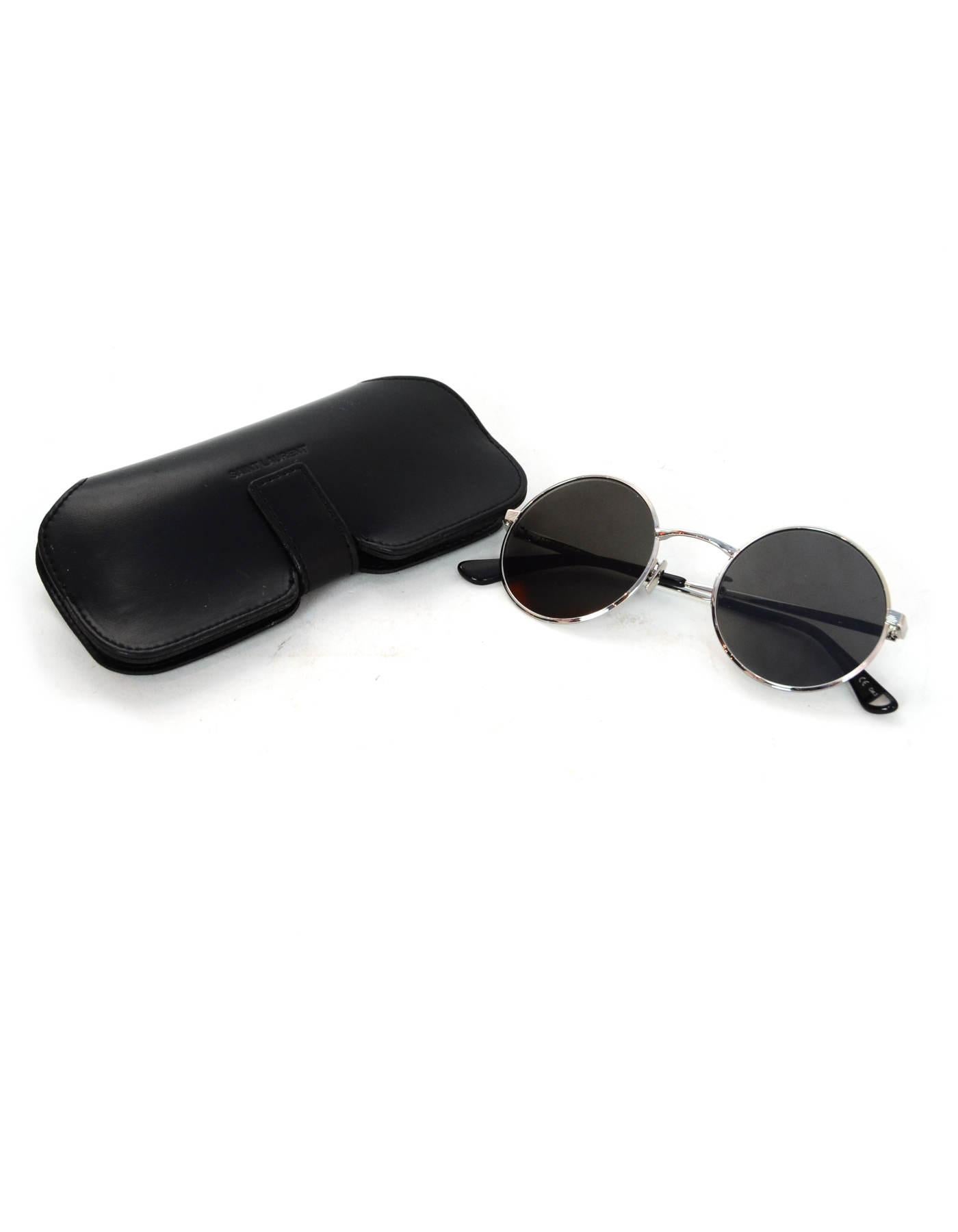 Saint Laurent YSL Black/Silver SL 136 Zero Round Unisex Sunglasses W/ Case

Made In: Italy 
Color: Black and silver
Hardware: Silvertone
Materials: Metal
Overall Condition: Excellent pre-owned condition  
Estimated Retail: $405 + tax
Includes: