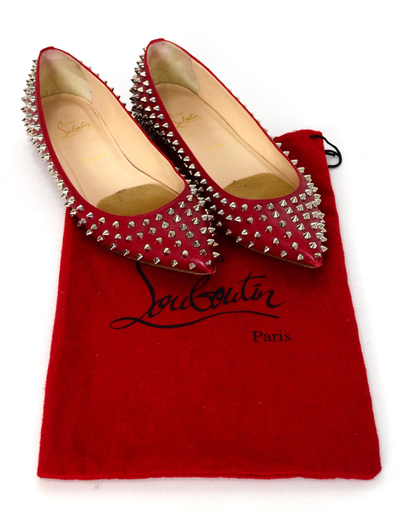 Christian Louboutin Red Leather Silver Spikes Pigalle Pointed Toe Flats Sz 41

Made In: Italy
Color: Red and silver
Hardware: Silvertone
Materials: Leather and metal 
Closure/Opening: Slide on
Overall Condition: Very good pre-owned condition with