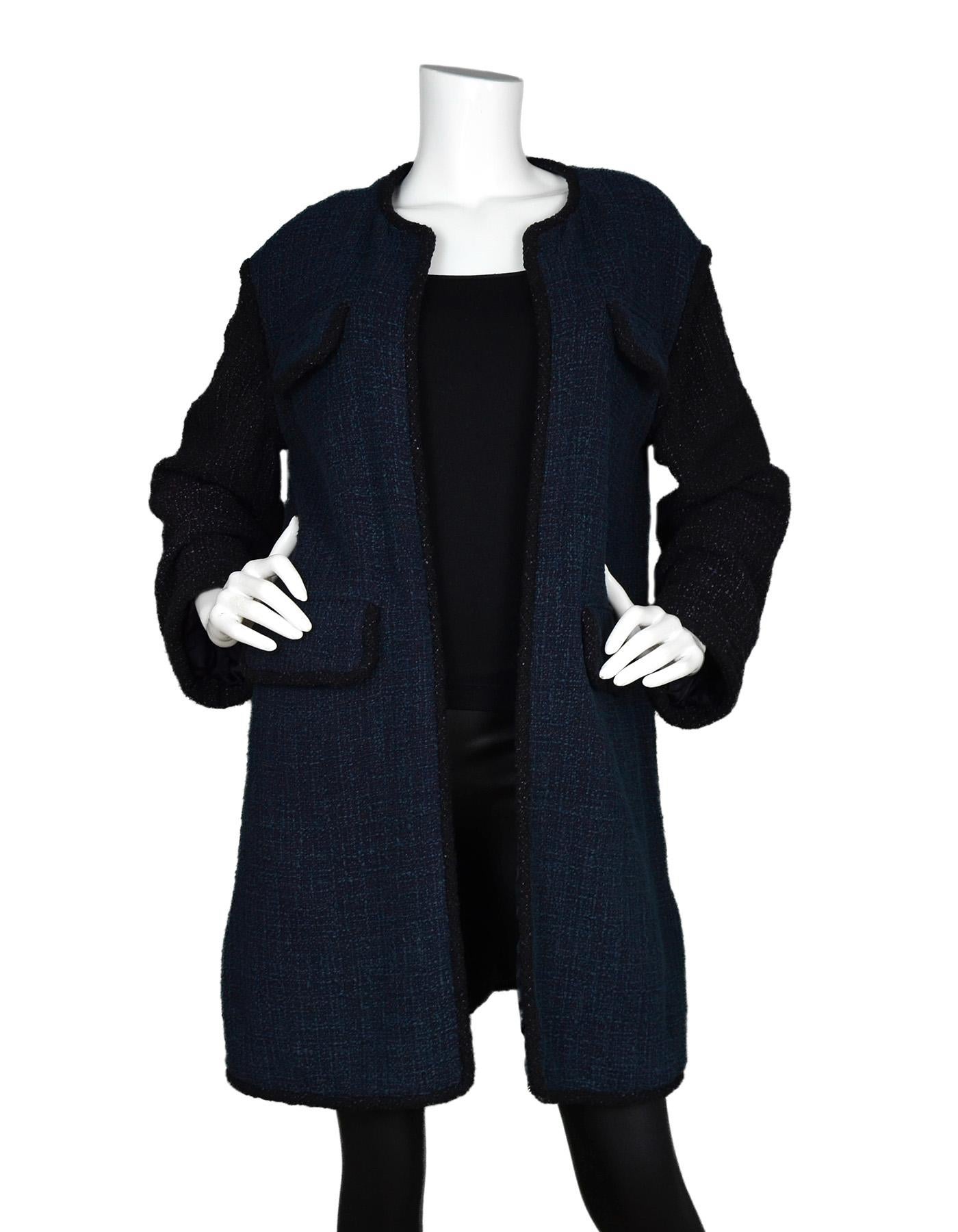 Chanel Navy Blue /Eggplant Purple Boucle Tweed Open Coat Sz 38

Made In: France 
Color: Navy blue and eggplant purple
Materials: 90% cotton, 10% rayon
Lining: 100% silk, jacquard logo and floral lining 
Opening/Closure: Open front
Overall Condition: