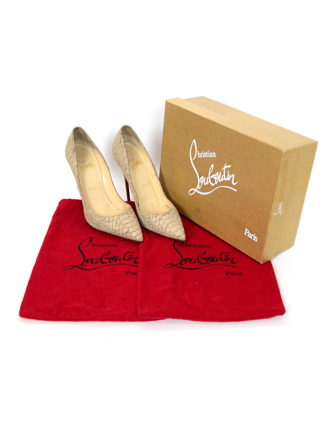 Christian Louboutin Tan Python So Kate Heels Pointed Toe Pumps Sz 38.5

Made In: Italy
Color: Tan
Materials: Python
Closure/Opening: Slide on
Overall Condition: Excellent pre-owned condition 
Includes:  Box and two dust bags

Measurements: 
Marked