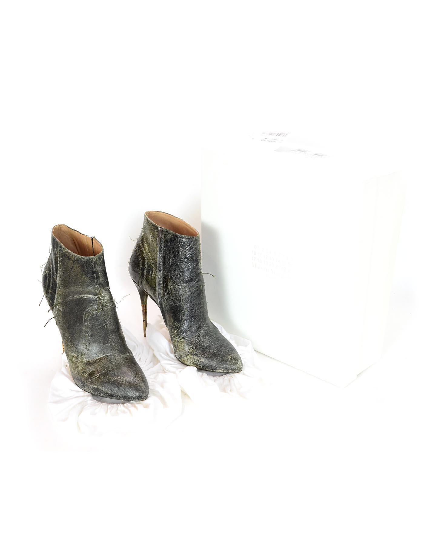 Maison Margiela Distressed Green Leather Heeled Booties Sz 39

Made In: Italy
Color: Green
Hardware: Gray
Materials: Distressed leather 
Closure/Opening: Side zipper 
Overall Condition: Excellent pre-owned top with minor wear to soles
Includes: 