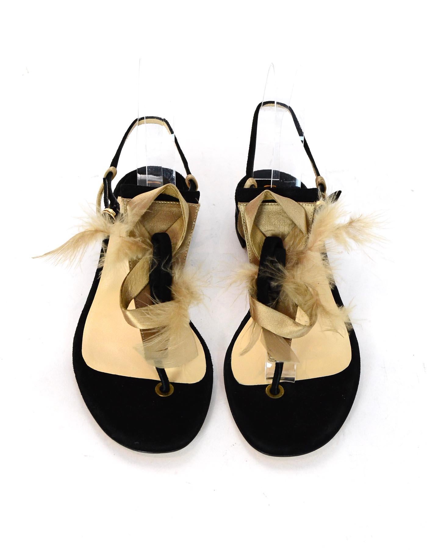 Jour Black Suede Sandals W/ Feather Detail Sz 38

Made In: Italy
Color: Black/tan
Hardware: Goldtone
Materials: Suede and feather
Closure/Opening: Goldtone buckle strap
Overall Condition: Excellent like new condition 
Estimated Retail: $675 +