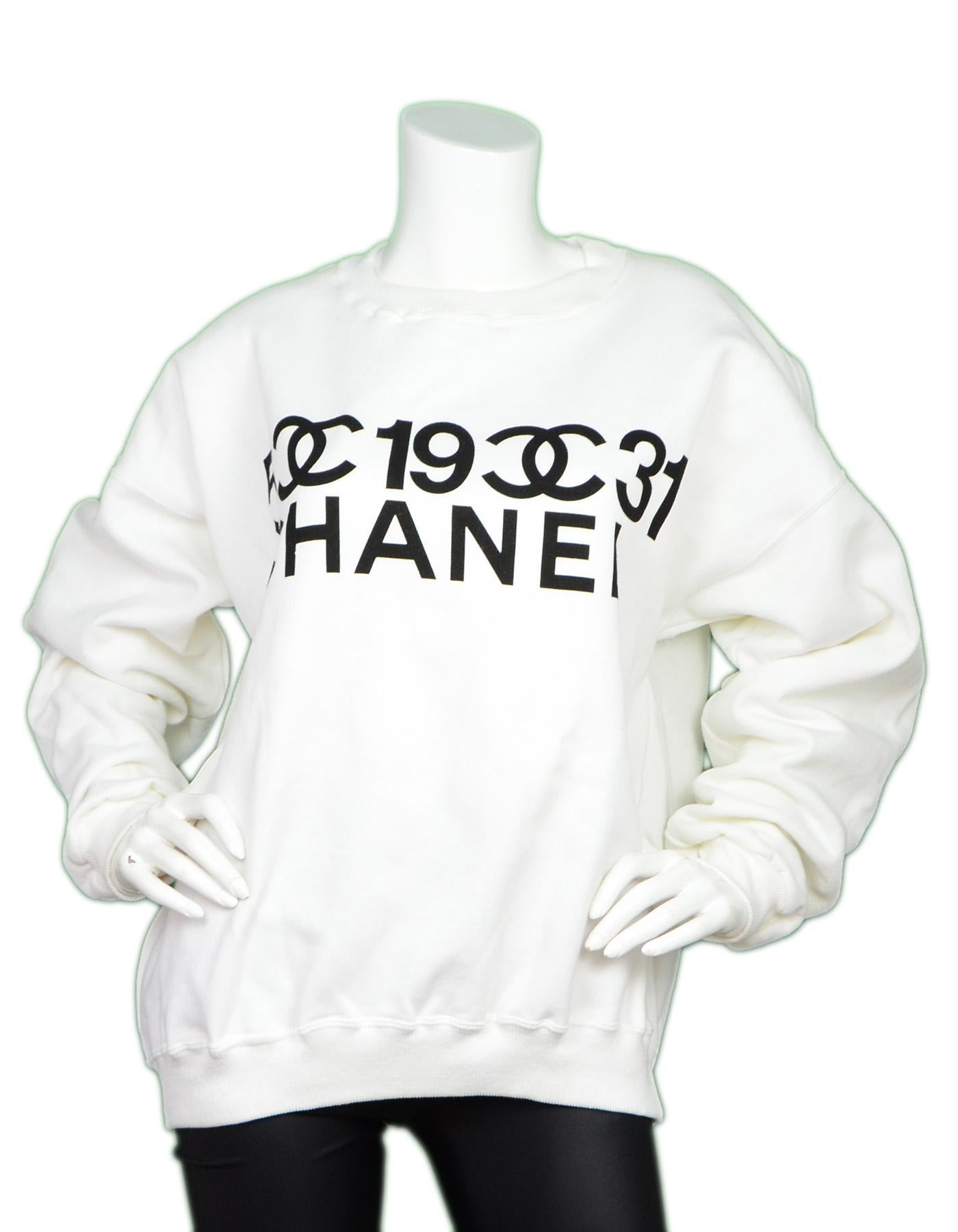 Chanel 2001 White/Black Crew Neck Logo Hoodie Sz Large

Made In: France 
Year of Production: 2001
Color: White and black
Materials: 100% cotton
Opening/Closure: Pullover
Overall Condition: Excellent pre-owned condition 
Includes: Tag and Chanel