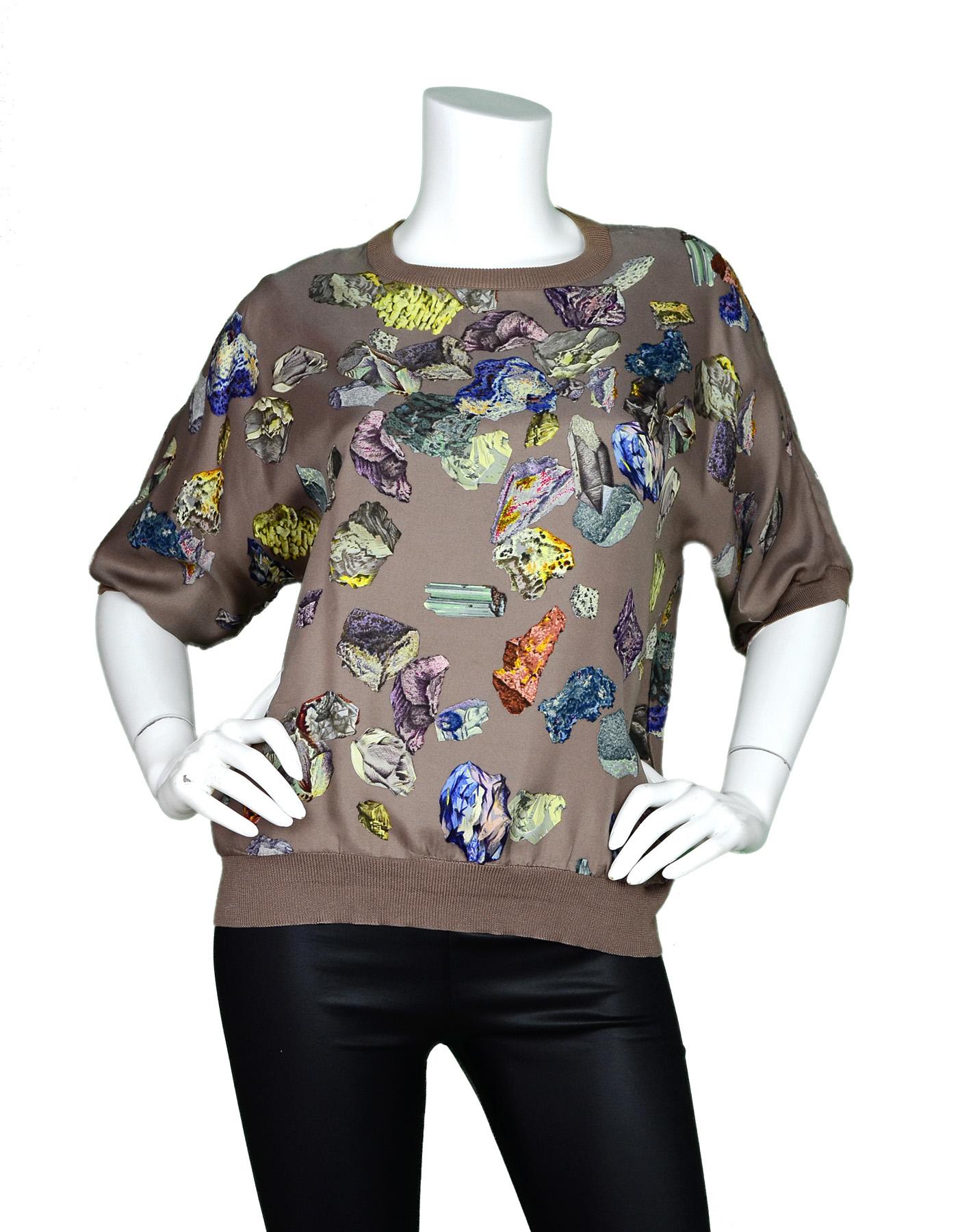 Hermes Vintage Tan Silk Short Sleeve Crew Neck Top W/ Gem Rock Design Sz 42

Made In: France
Color: Tan and multi-color
Materials: 100% silk
Opening/Closure: Pull over
Overall Condition: Excellent vintage, pre-owned condition with the exception of a