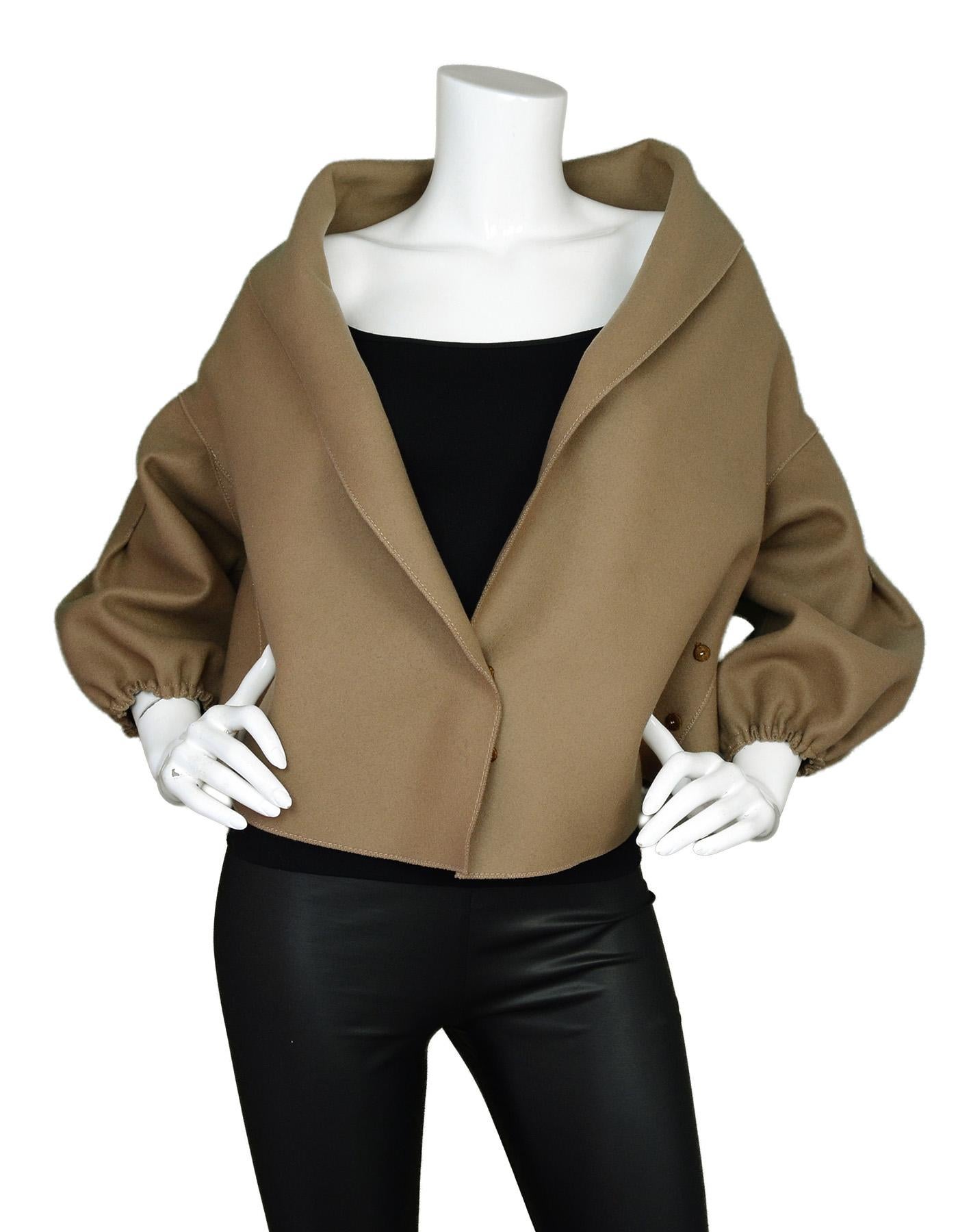 Prada Camel Wool 3/4 Sleeve Cropped Bolero Wrap Jacket Sz 38

Made In: Italy
Color: Camel
Materials: 89% wool, 11% nylon
Opening/Closure: Wrap front with two sets of snaps
Overall Condition: Excellent pre-owned condition 

Measurements: 
Shoulder To