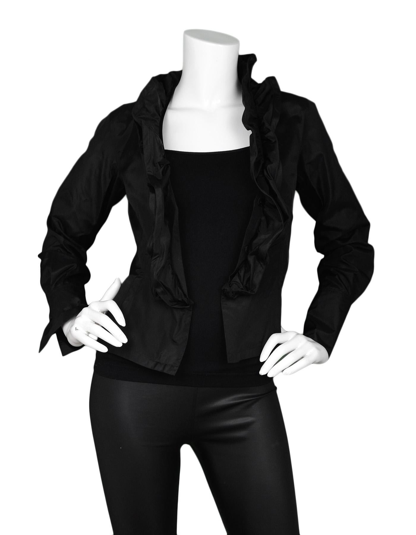Donna Karan Black Ruffle Front Silk Jacket Sz 2

Made In: China
Color: Black
Materials: 100% silk
Opening/Closure: Snap front closure 
Overall Condition: Excellent pre-owned condition 

Measurements: 
Shoulder To Shoulder: 14
