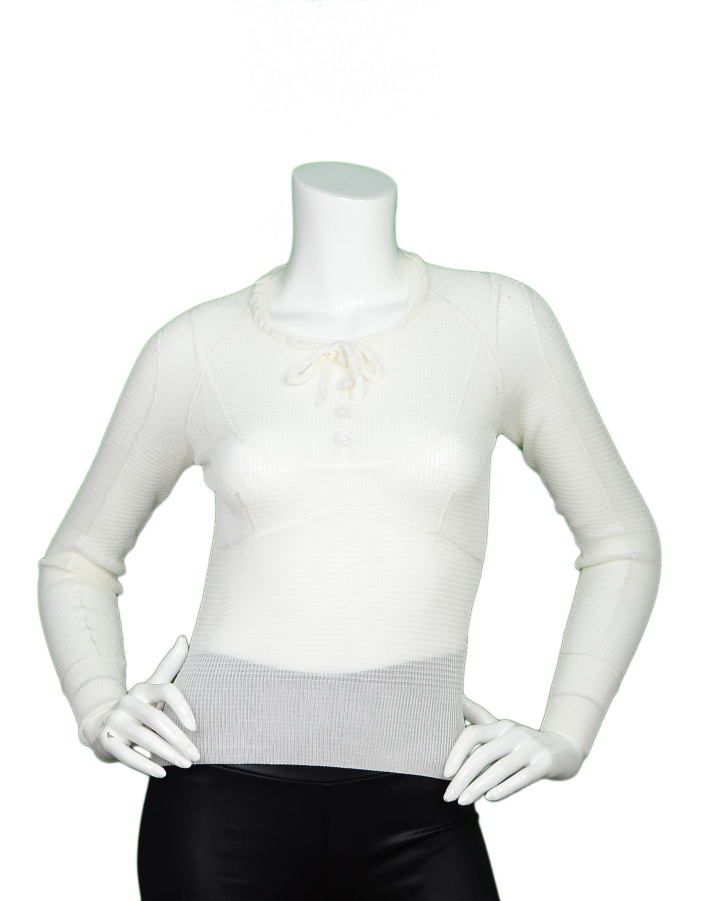 Louis Vuitton Cream Long-Sleeve Silk Waffle Sheer Knit Top W/ White Flower Buttons & Tie Neck Sz S

Made In: Italy
Color: Cream
Materials: Silk waffle knit (no composition tag)
Opening/Closure: Pull over
Overall Condition: Excellent pre-owned