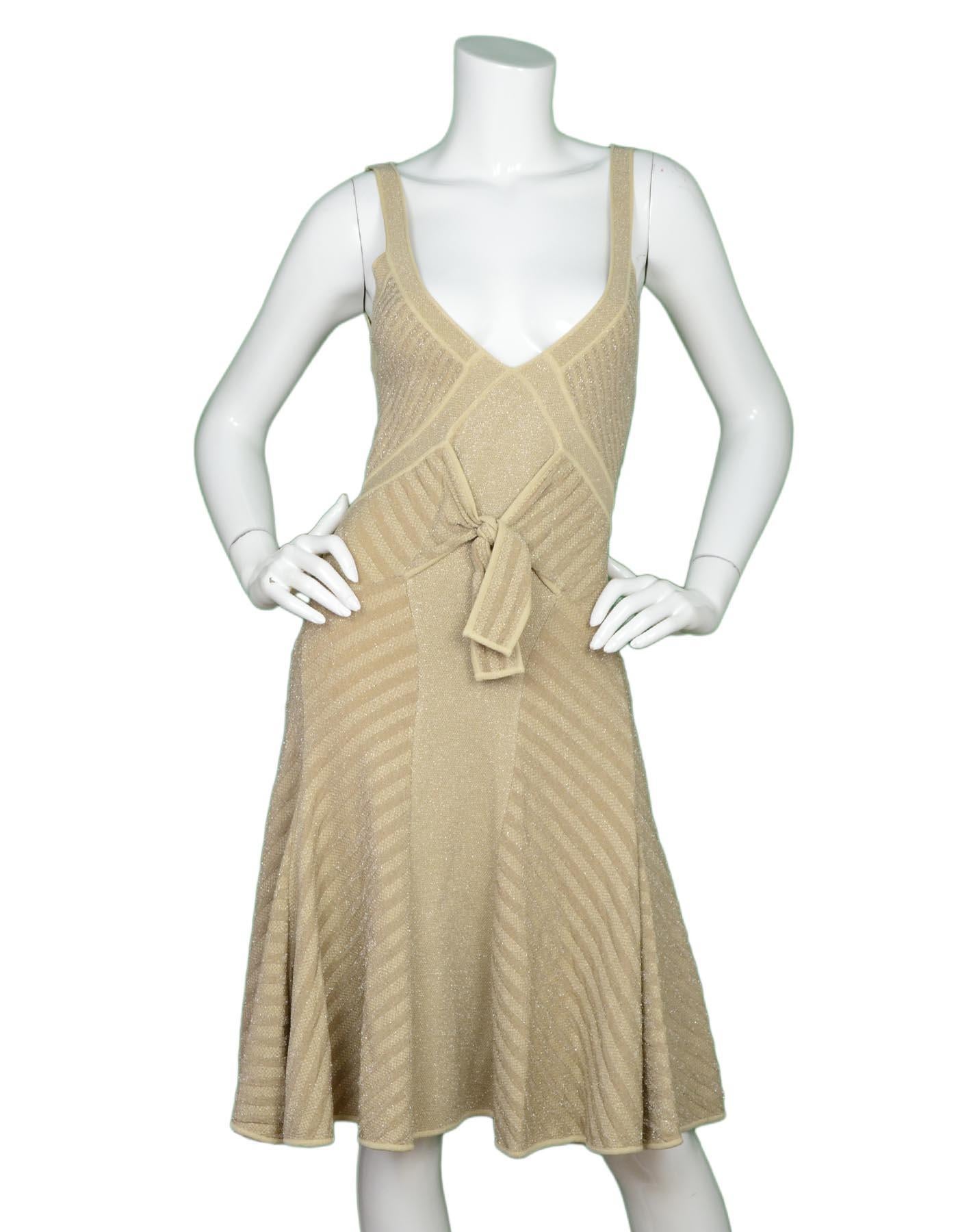 Zac Posen Tan Sleeveless V-Neck Flare Bow Dress W/ Silver Lurex Sz L

Made In: Italy
Color: Tan w/ silver lurex
Materials: 76% rayon, 13% elite polyester, 11% polyester
Opening/Closure: Pull over
Overall Condition: Excellent pre-owned condition