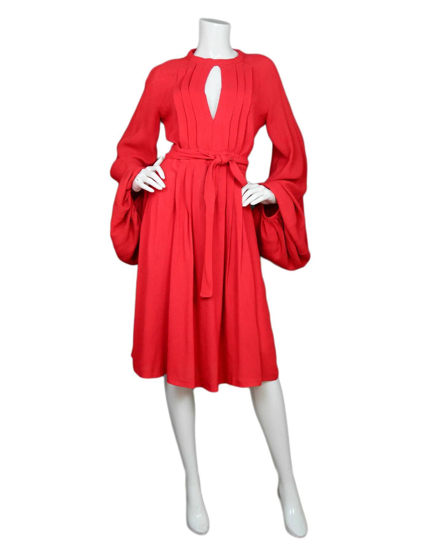 Ossie Clark Vintage '60s Red Crepe Wrap Dress Sz 14

Made In:  London
Year of Production: 1960's
Color: Red
Materials: Crepe fabric, no composition tag
Opening/Closure: Back hook-eye closure 
Overall Condition: Very good vintage, pre-owned condition