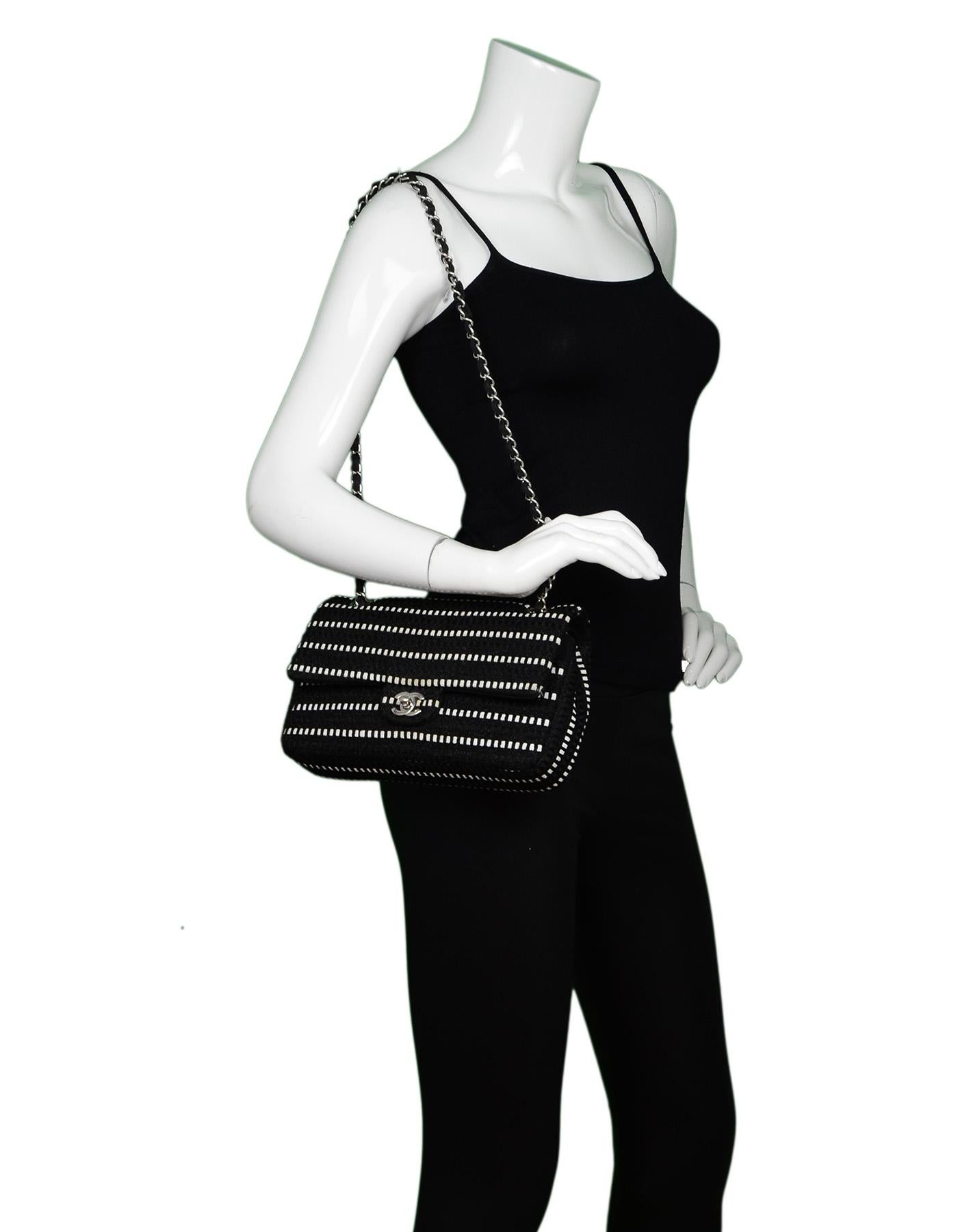 Chanel Black Sparkle/White Tweed Double Flap Bag W/ Silvertone CC Hardware 

Made In: France
Year of Production: 2014
Color: Black/white
Hardware: Silvertone
Materials: Black sparkle and white woven tweed, 
Lining: Black and cream textile
