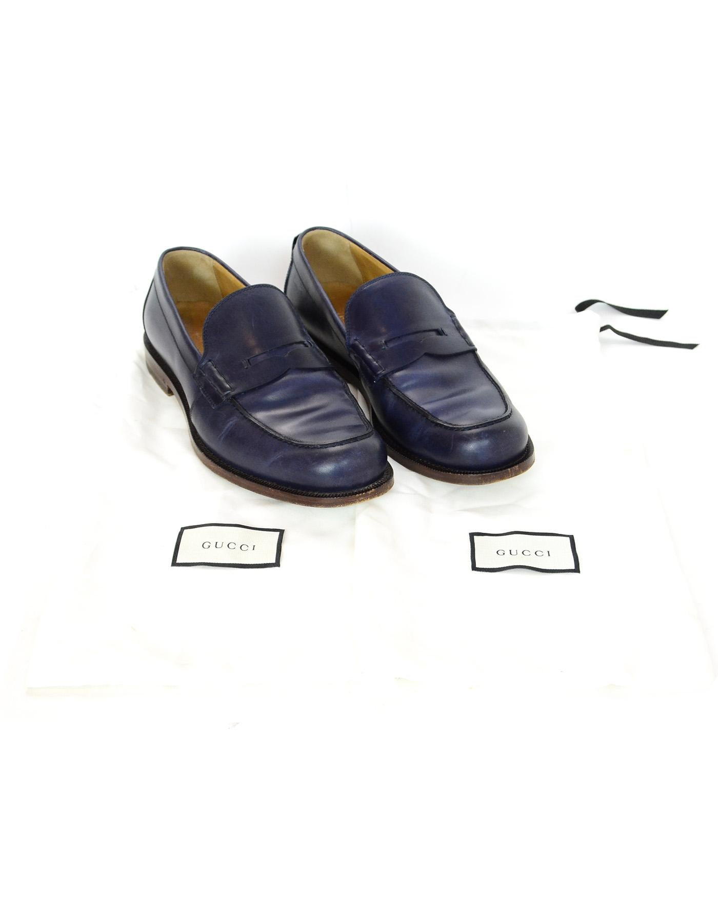 Gucci Navy Men's Penny Loafers W/ Web Sz 9 
Made In: Italy
Color: Navy
Materials: Leather
Closure/Opening: Slide on
Overall Condition: Excellent pre-owned condition with the exception of some scratching/scuffing throughout leather 
Included: Two