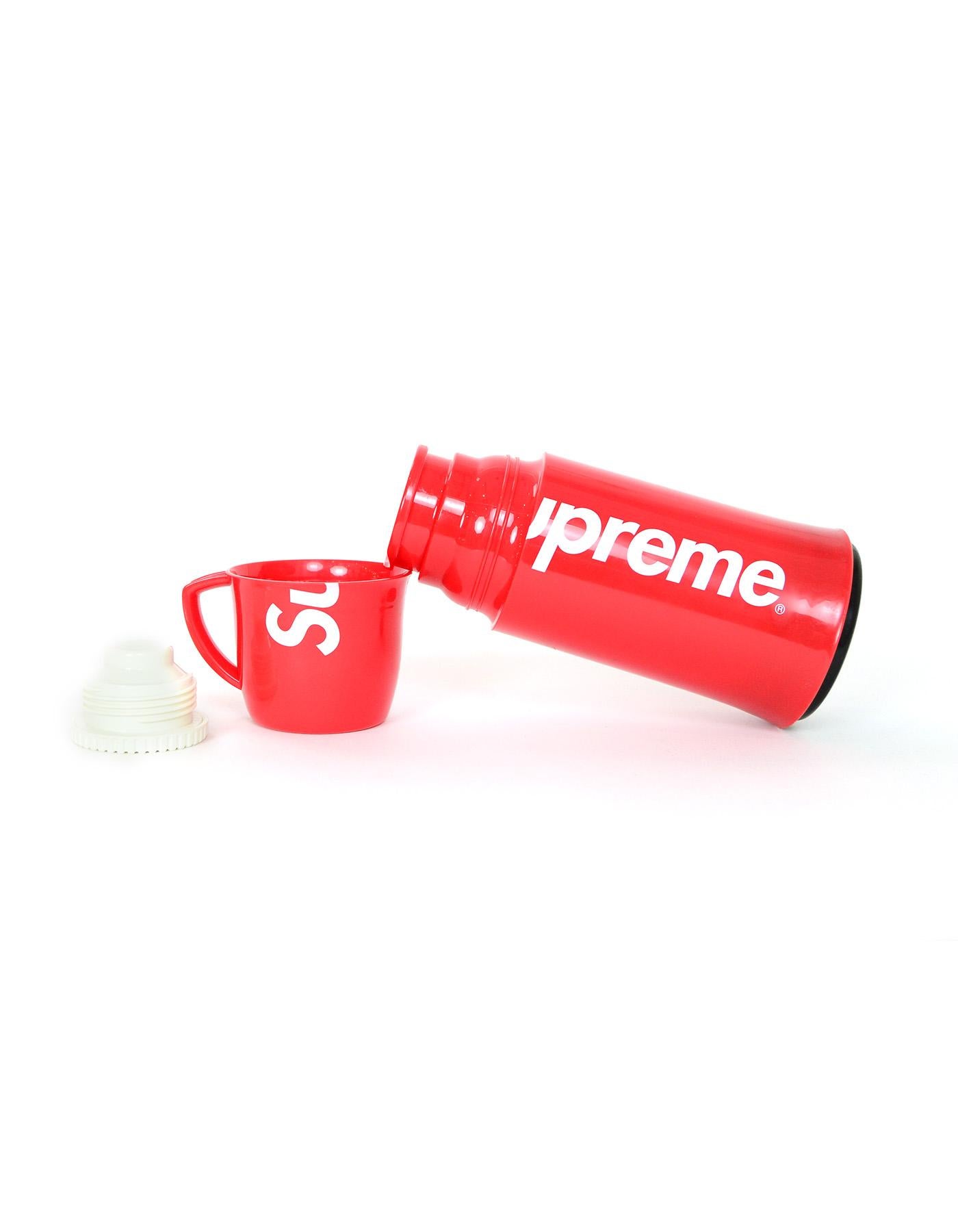 Supreme x Helios Red Thermos W/ White Logo 

Made In: Germany 
Color: Red and white
Materials: Plastic and metal
Closure/Opening: Twist top 
Overall Condition: Excellent pre-owned condition with exception of some scratches in the
