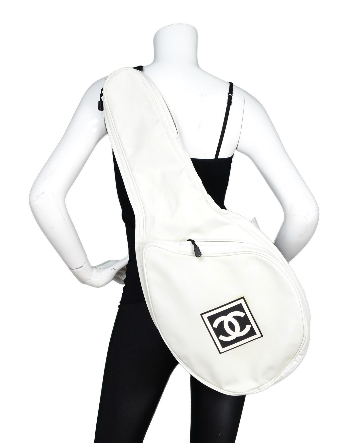 Chanel Off White Canvas Tennis Racquet Cover Bag W/ Rubber CC Logo On Front

Made In: Italy
Year of Production: 2003-2004
Color: Off-white and black
Hardware: Black
Materials: Canvas and nylon
Lining: Black nylon
Closure/Opening: Two zippers