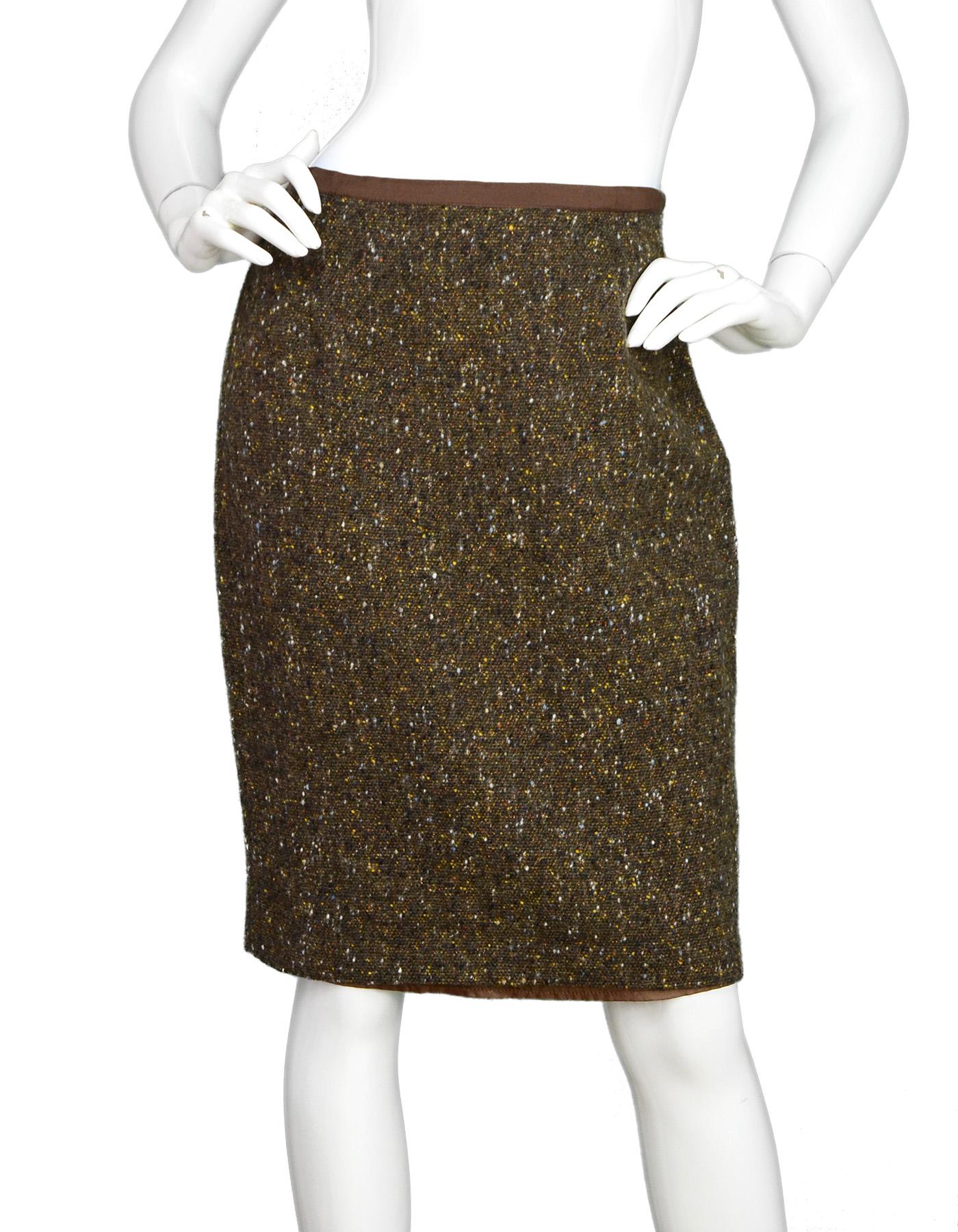 Blumarine Brown Tweed Pencil Skirt Sz 44. Pictured With Matching Brown Tweed Jacket W/ Sheared Mink Collar Sz 42, Item #15870-18.

Made In: Italy
Color: Multi-tonal brown/bronze tweed
Materials: 77% wool 15% nylon, 5% rayon, 3% polyester
Lining: 60%